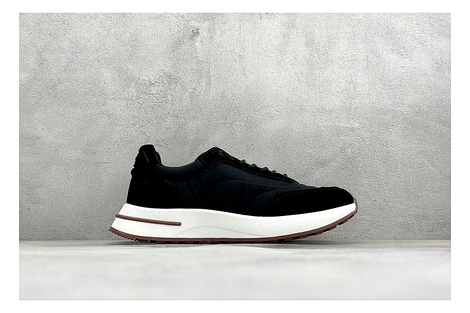 Loro Piana Week-End Black comparison image with black suede upper, low casual profile, striped midsole accent, and soft everyday shape thumbnail 6