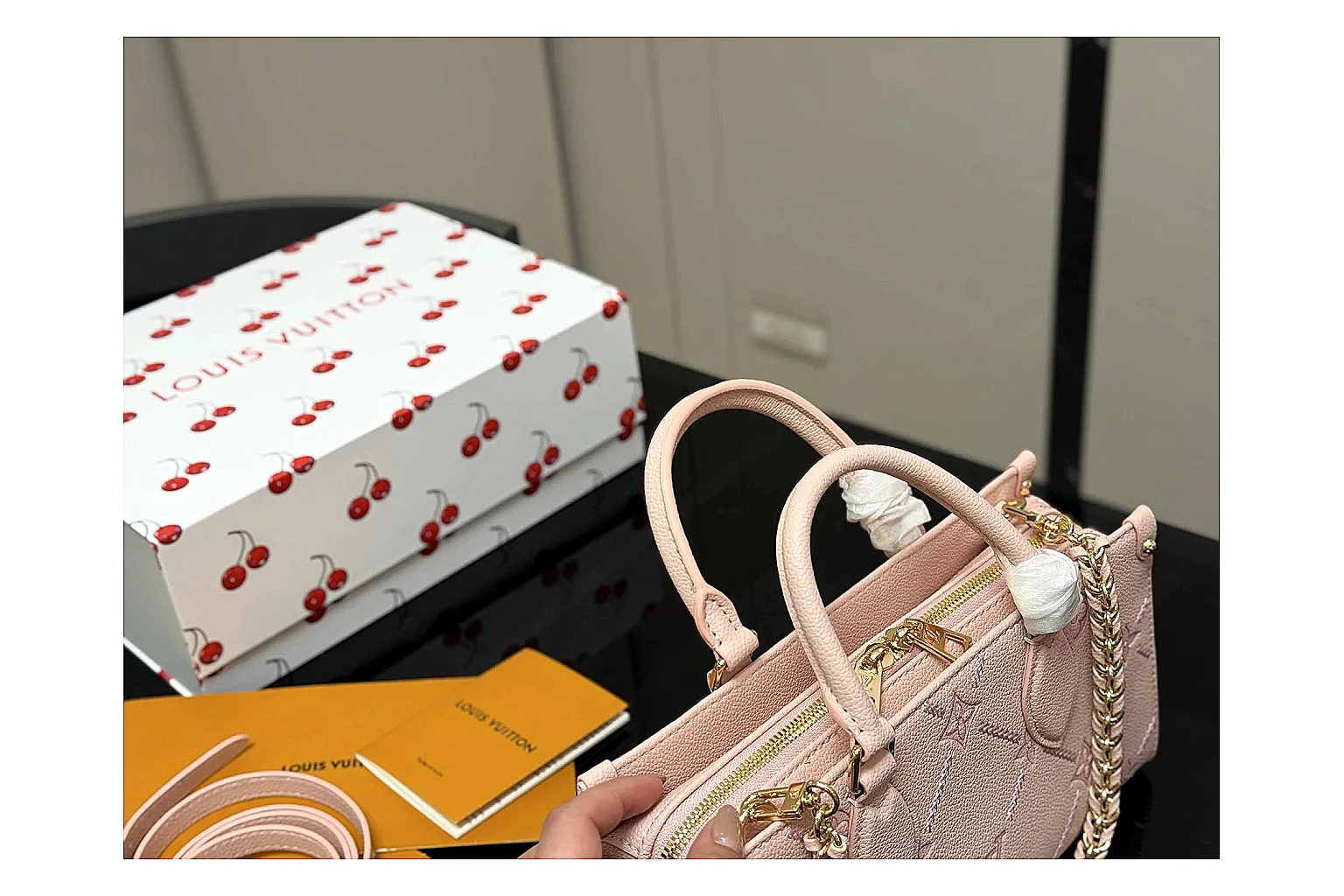 Louis Vuitton Mini Top Handle Pink comparison photo showing pink leather mini bag body, structured top handle, compact luxury shape, and clean hardware details