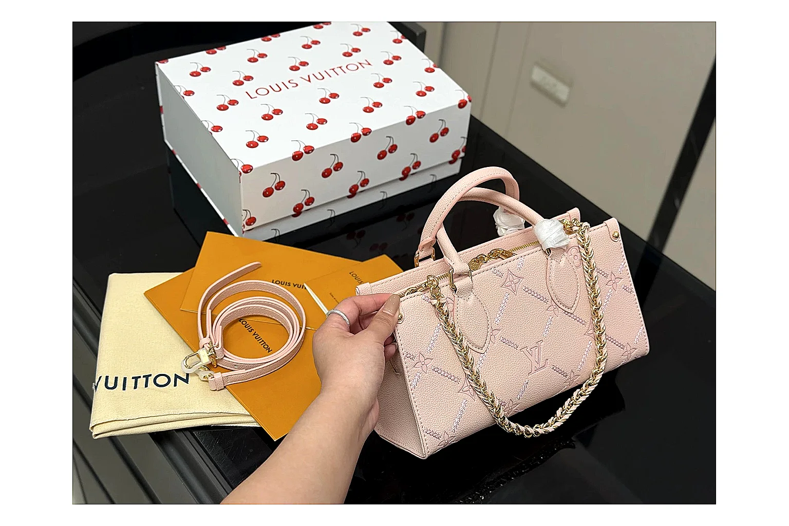 Louis Vuitton Mini Top Handle Pink comparison photo showing pink leather mini bag body, structured top handle, compact luxury shape, and clean hardware details thumbnail 6