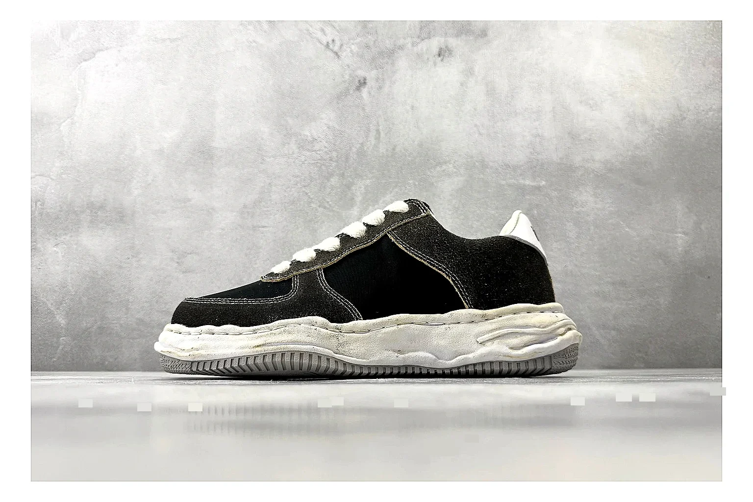 Maison Mihara Yasuhiro Blakey Black Distressed comparison photo showing black distressed canvas upper, warped sculpted white sole, low lace profile, and worn texture