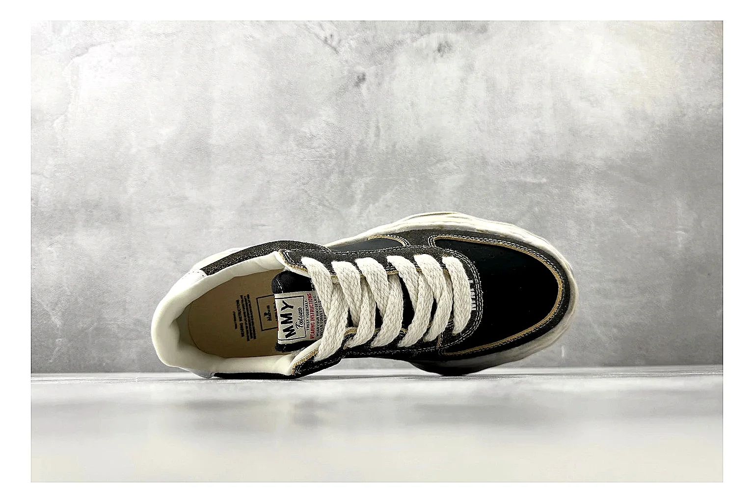 Maison Mihara Yasuhiro Blakey Black Distressed comparison photo showing black distressed canvas upper, warped sculpted white sole, low lace profile, and worn texture