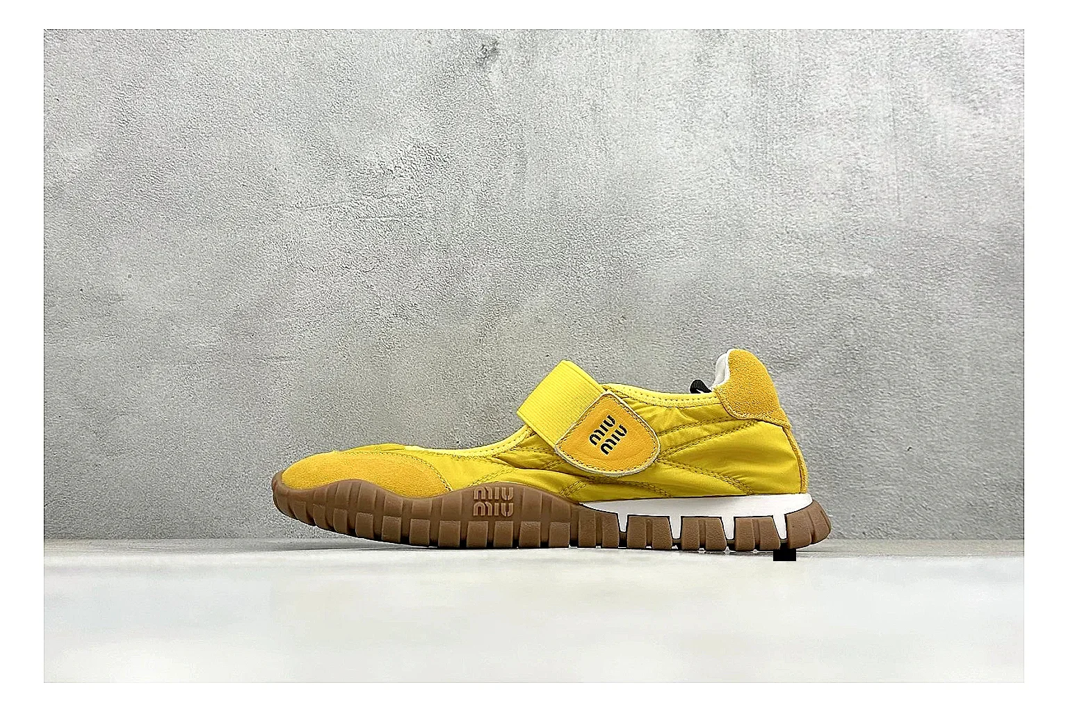 Miu Miu Tyre Yellow Mary Jane comparison photo showing yellow Mary Jane upper, strap closure, rugged Tyre outsole, and playful low-profile shape