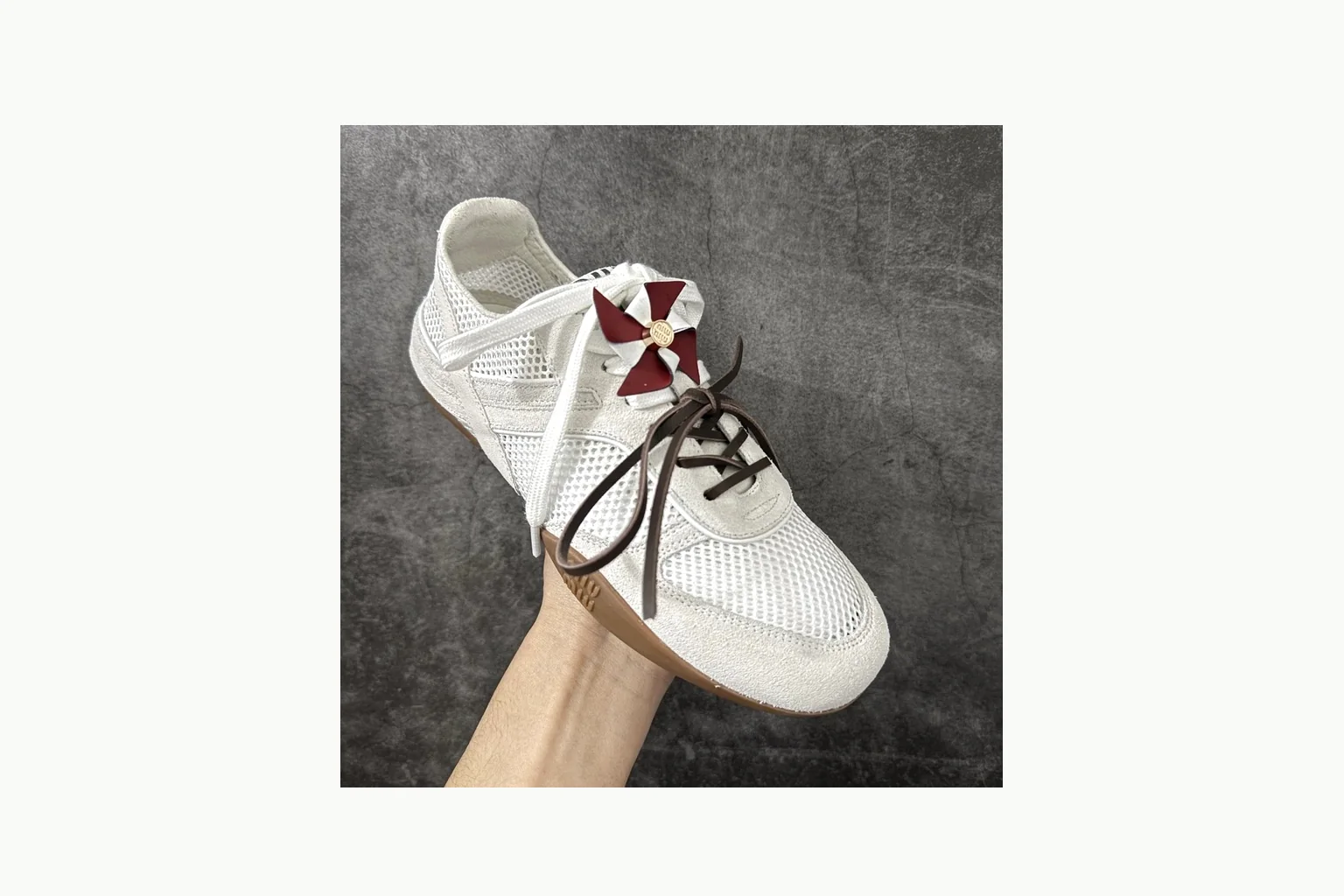 Miu Miu White Bow Sneaker comparison signal photo with white bow-detail low-top with mixed-material upper and low-profile shape