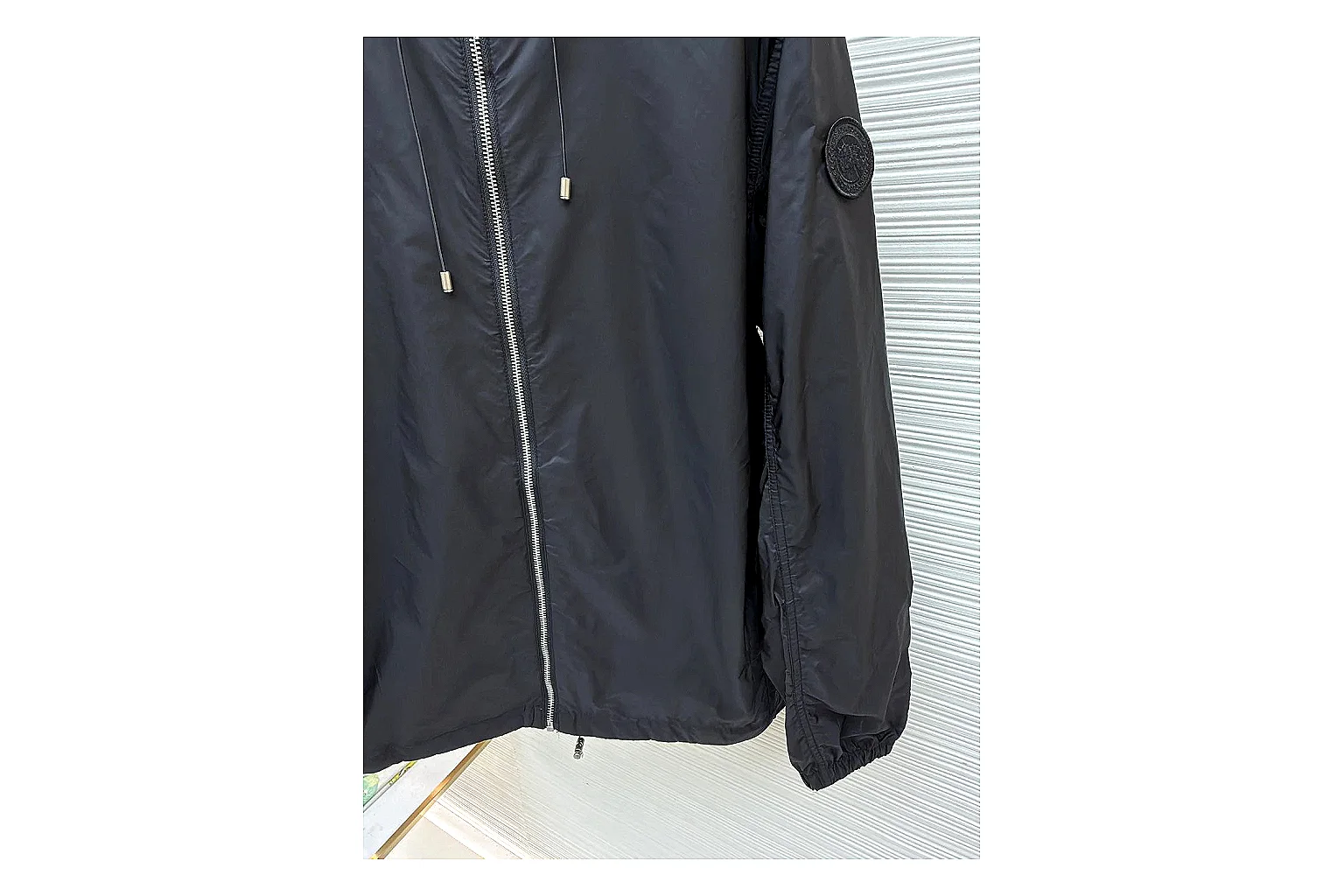 Moncler Nylon Hooded Jacket Black Jacket comparison signal photo with black nylon hooded jacket with nylon texture, hood structure, zipper line, sleeve cuffs, and light shell shape