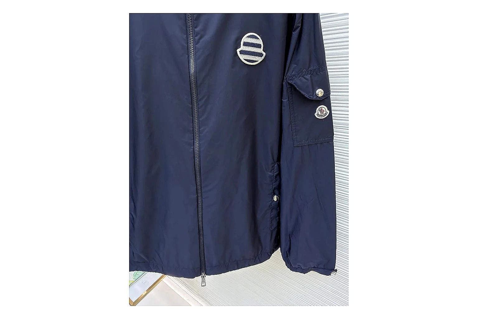 Moncler Nylon Hooded Jacket Navy Jacket comparison signal photo with navy nylon hooded jacket with nylon texture, hood structure, zipper line, sleeve cuffs, and light shell shape