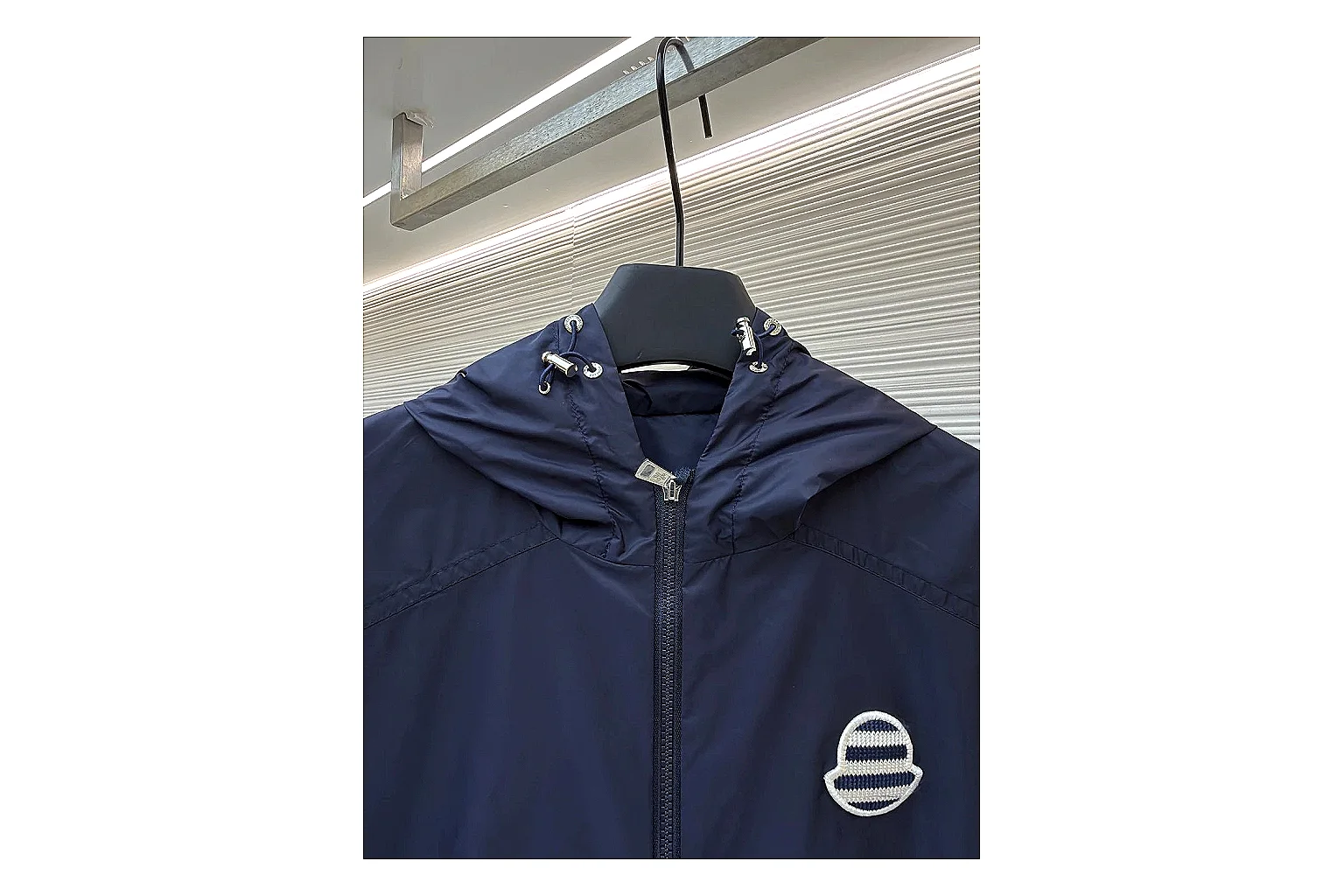 Moncler Nylon Hooded Jacket Navy Jacket comparison signal photo with navy nylon hooded jacket with nylon texture, hood structure, zipper line, sleeve cuffs, and light shell shape thumbnail 6