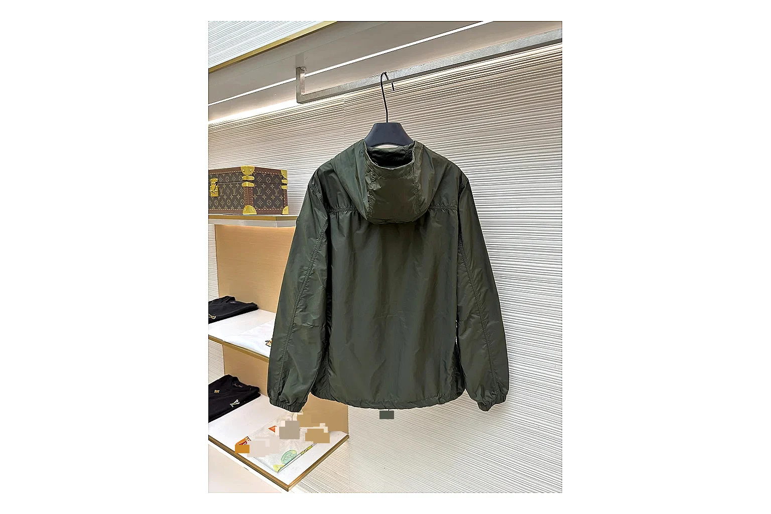 Moncler Nylon Hooded Jacket Olive Jacket comparison signal photo with olive nylon hooded jacket with nylon texture, hood structure, zipper line, sleeve cuffs, and light shell shape