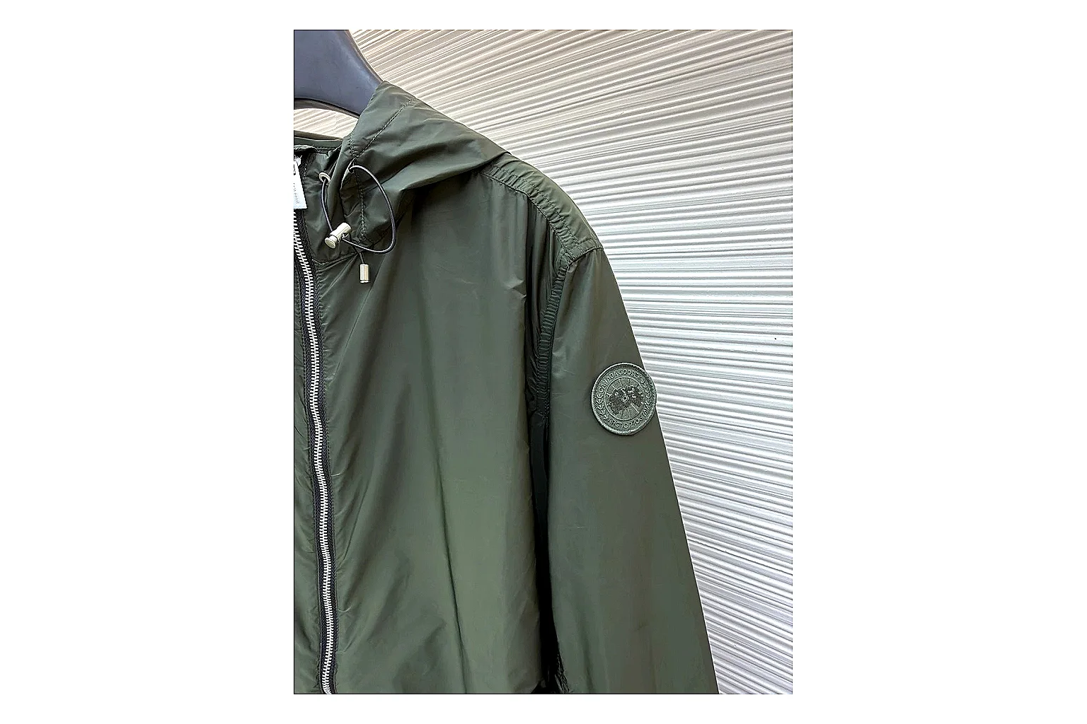 Moncler Nylon Hooded Jacket Olive Jacket comparison signal photo with olive nylon hooded jacket with nylon texture, hood structure, zipper line, sleeve cuffs, and light shell shape thumbnail 5