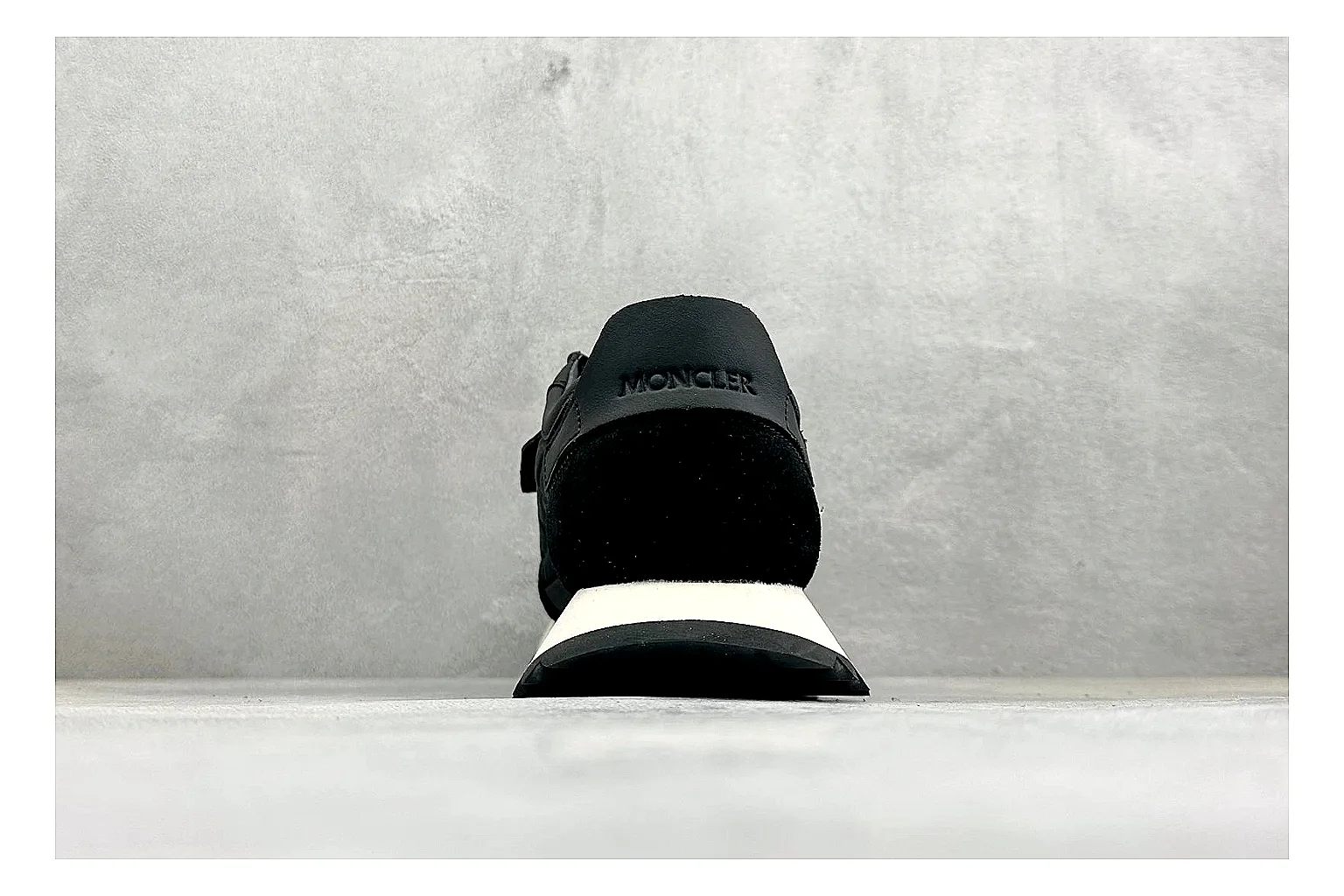 Moncler Pacey Black White comparison image with black upper, white rugged outsole, low padded collar, and outdoor-leaning tread profile thumbnail 3