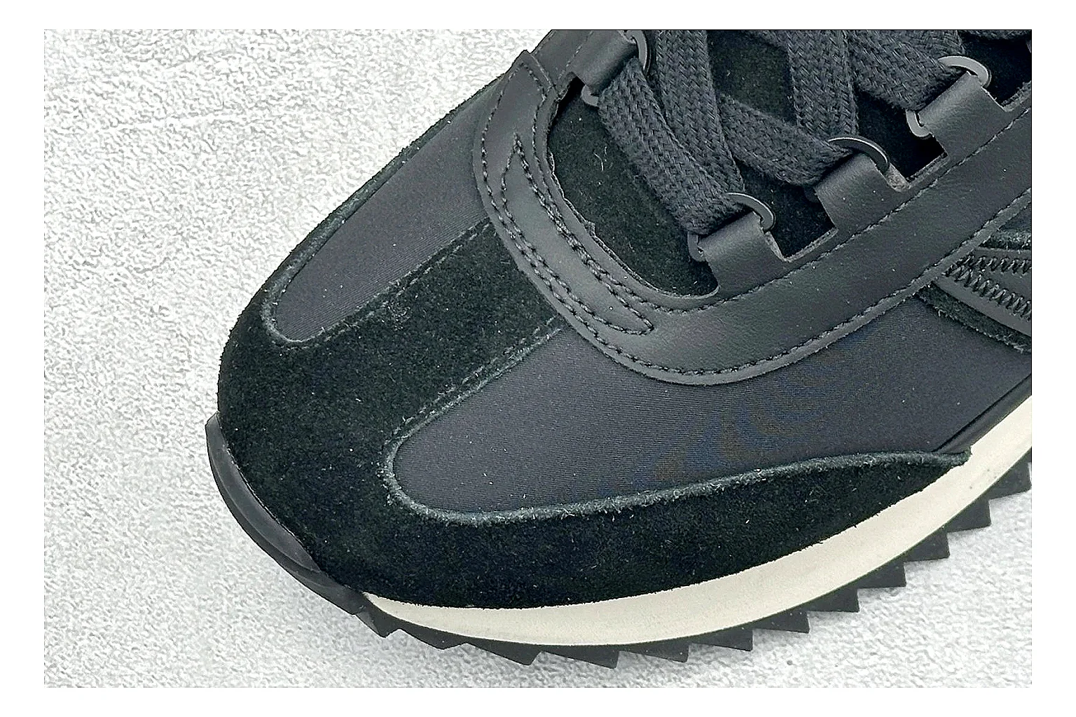 Moncler Pacey Black White comparison image with black upper, white rugged outsole, low padded collar, and outdoor-leaning tread profile thumbnail 5