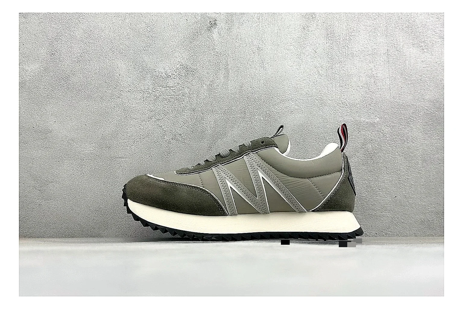 Moncler Pacey Grey Suede comparison image with grey suede upper, rugged white outsole, low collar, and soft neutral streetwear tone