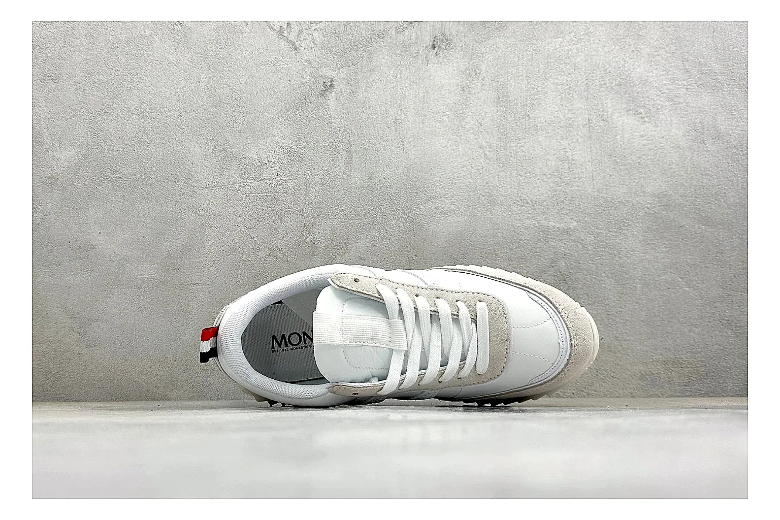 Moncler Pacey White Suede comparison image with light suede upper, chunky serrated outsole, low padded collar, and tonal casual build