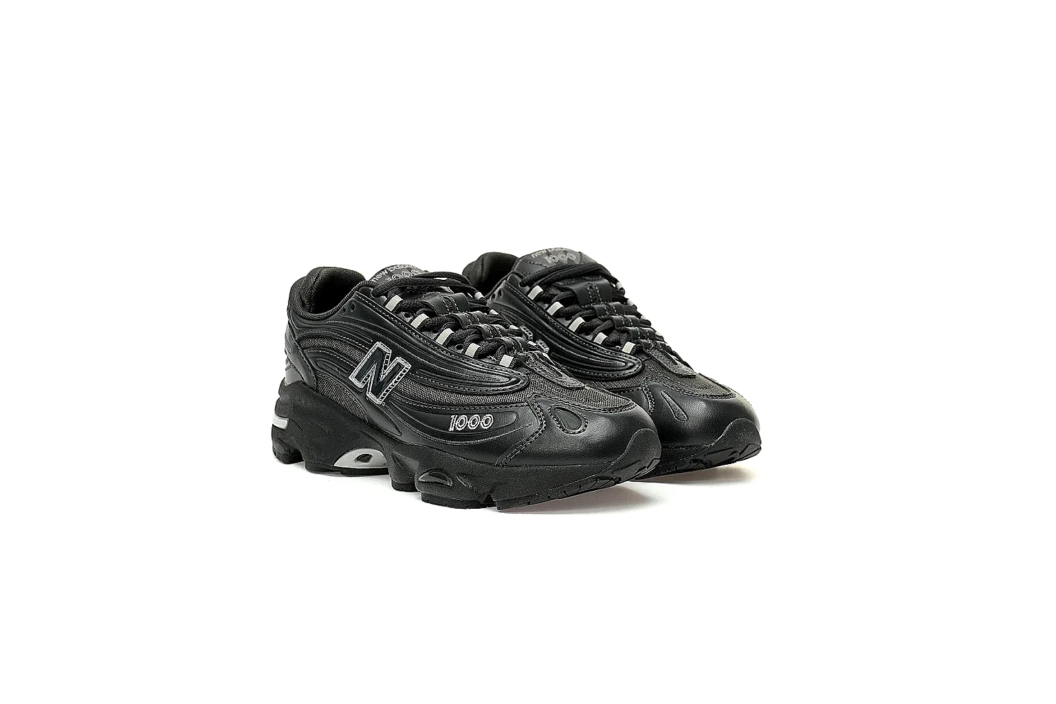 Black New Balance 1000 9807 side profile with mesh panels and silver accents thumbnail 5