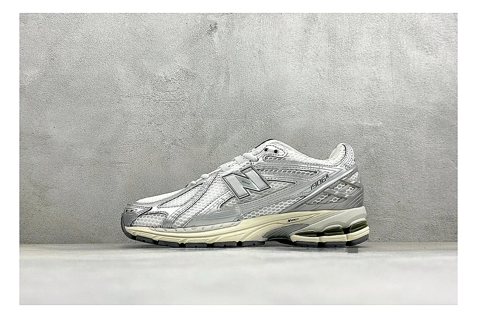 New Balance 1906 Silver Grey comparison image with silver overlays, grey mesh panels, technical runner structure, and layered midsole tooling