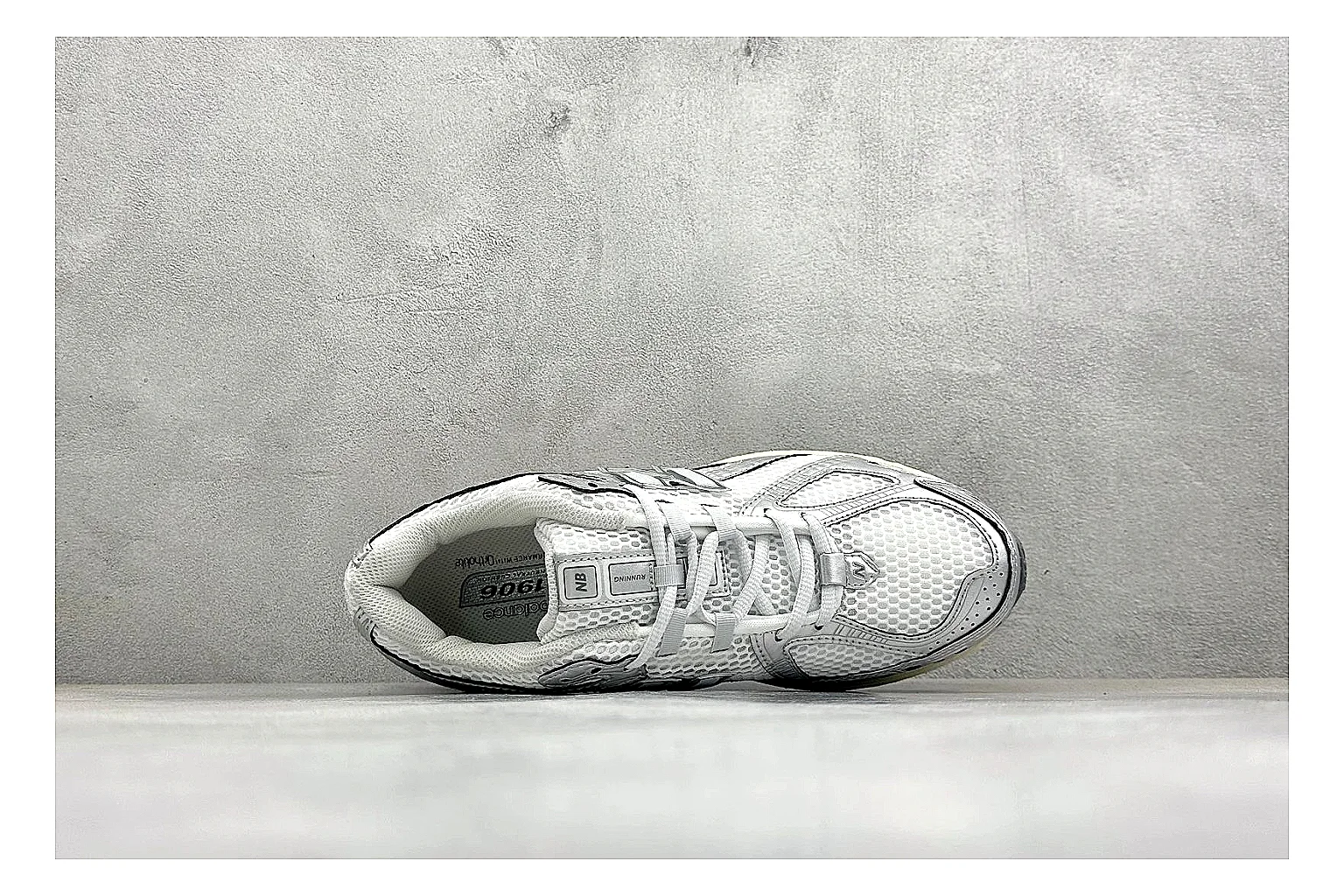 New Balance 1906 Silver Grey comparison image with silver overlays, grey mesh panels, technical runner structure, and layered midsole tooling thumbnail 2