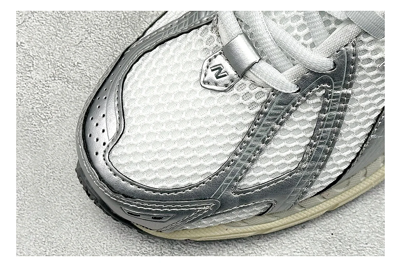 New Balance 1906 Silver Grey comparison image with silver overlays, grey mesh panels, technical runner structure, and layered midsole tooling thumbnail 5