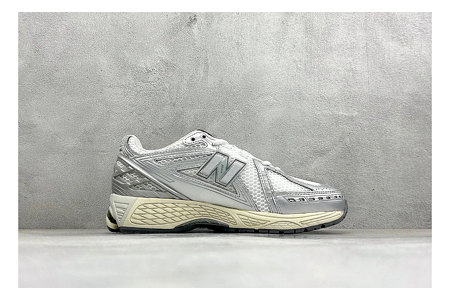 New Balance 1906 Silver Grey comparison image with silver overlays, grey mesh panels, technical runner structure, and layered midsole tooling thumbnail 6