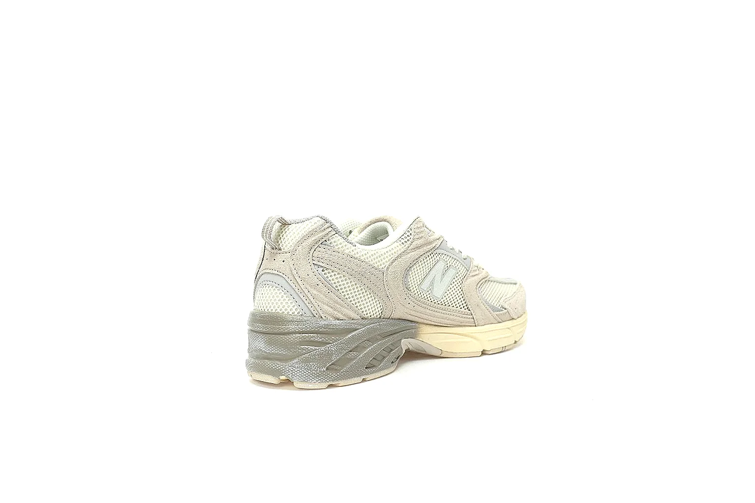 New Balance cream grey 2002R-style runner with visible N logo and heel detail