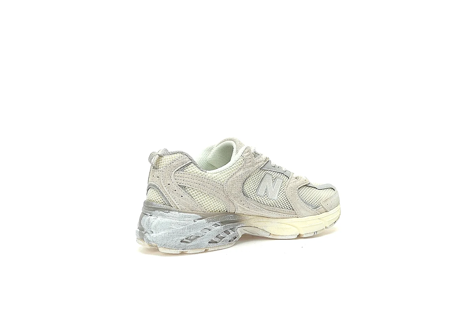 New Balance 2002R-style cream grey runner with visible side logo and QC angles