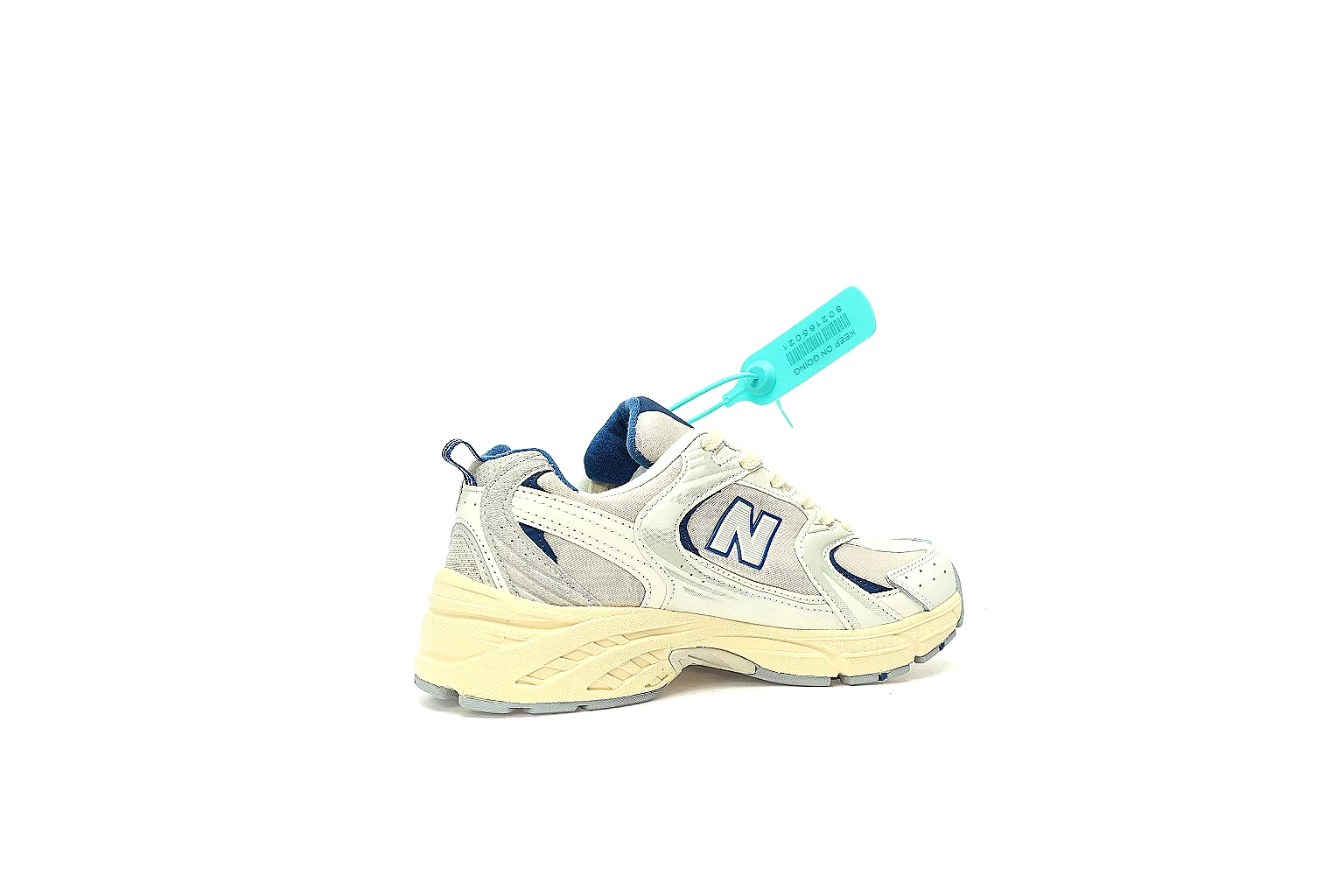 New Balance 530 cream navy side profile with navy N logo and ABZORB-style midsole thumbnail 2