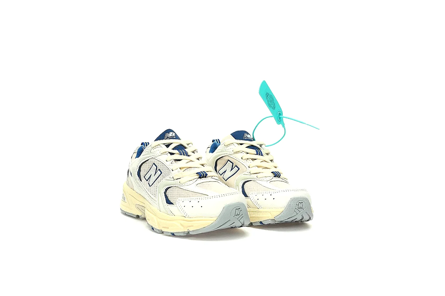 New Balance 530 cream navy side profile with navy N logo and ABZORB-style midsole thumbnail 5