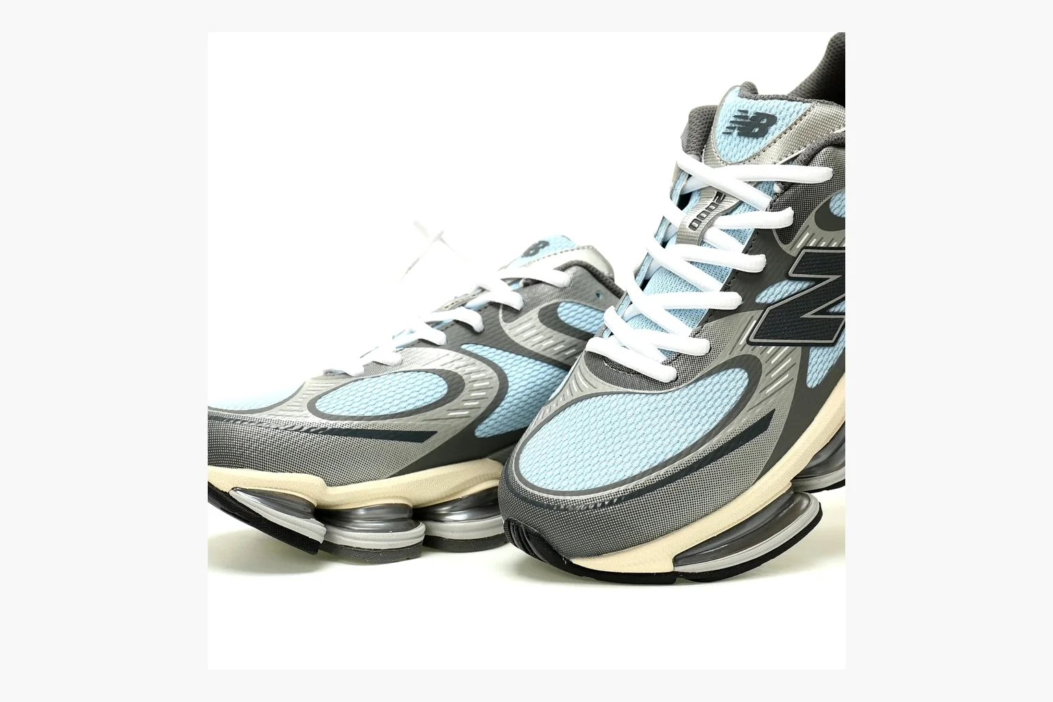New Balance 9060 Runner Sneaker Silver Teal comparison signal image with silver and teal NB 9060 runner with chunky sole, mesh panels, and side N logo thumbnail 5