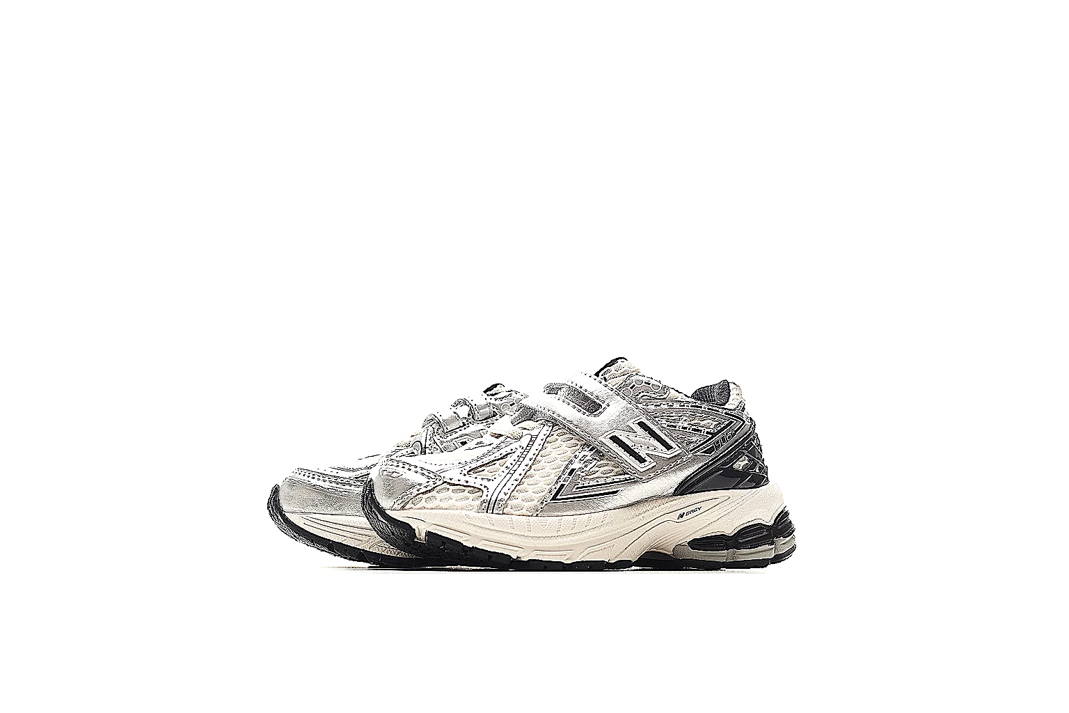 New Balance 9060 cream black strap runner with visible side logo and midsole