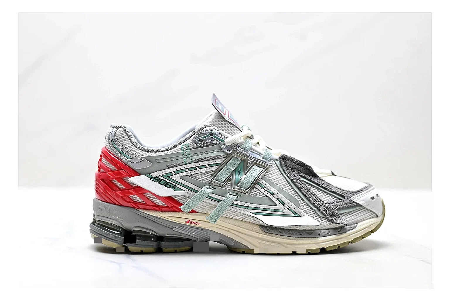 New Balance M1906 Silver Red Sneakers comparison signal photo with silver red retro runner sneakers with mesh-leather texture, side-profile shape, upper panel lines, and outsole detail
