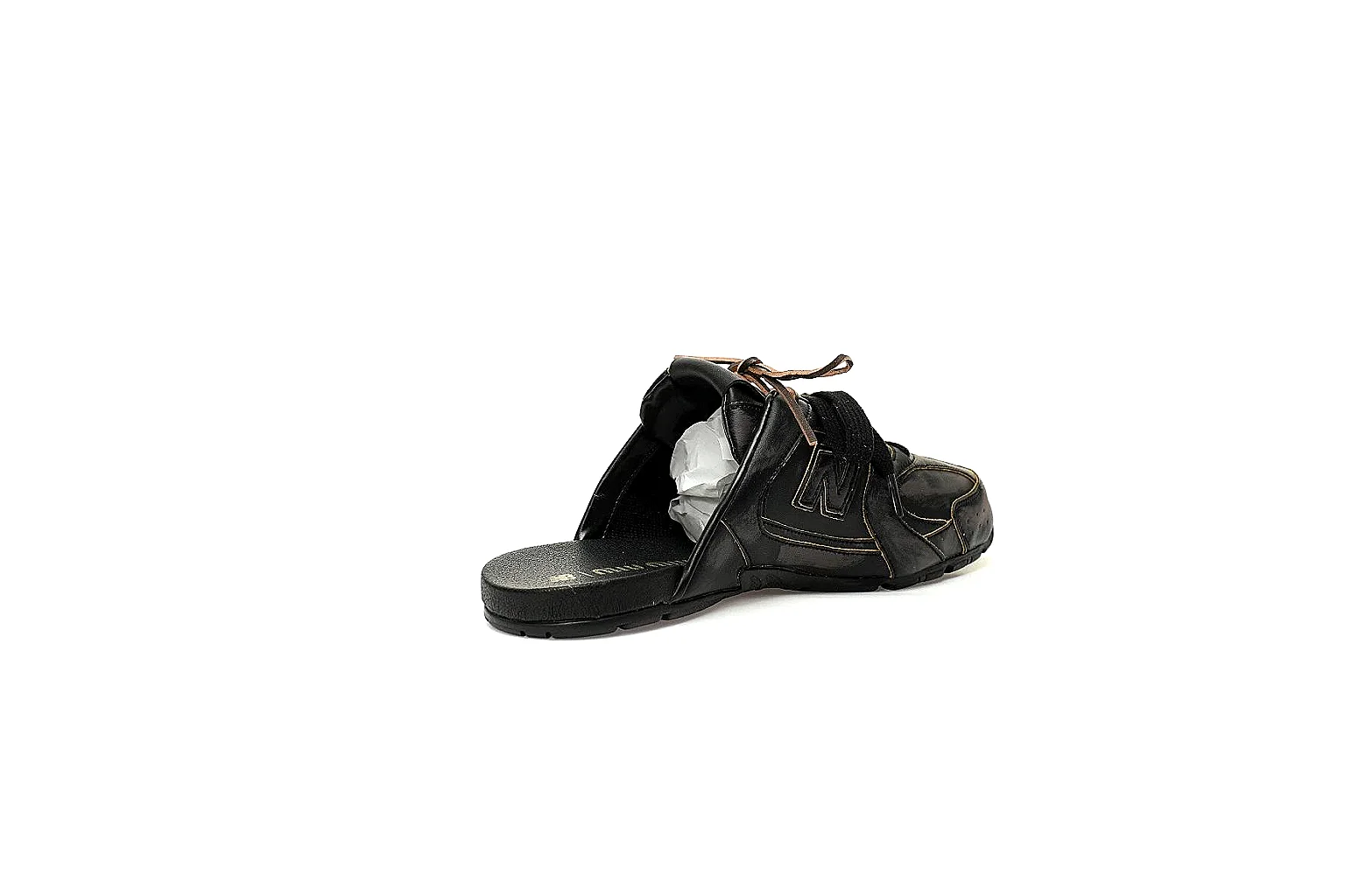 Black New Balance x Miu Miu mule trainer with visible side logo and glossy panels