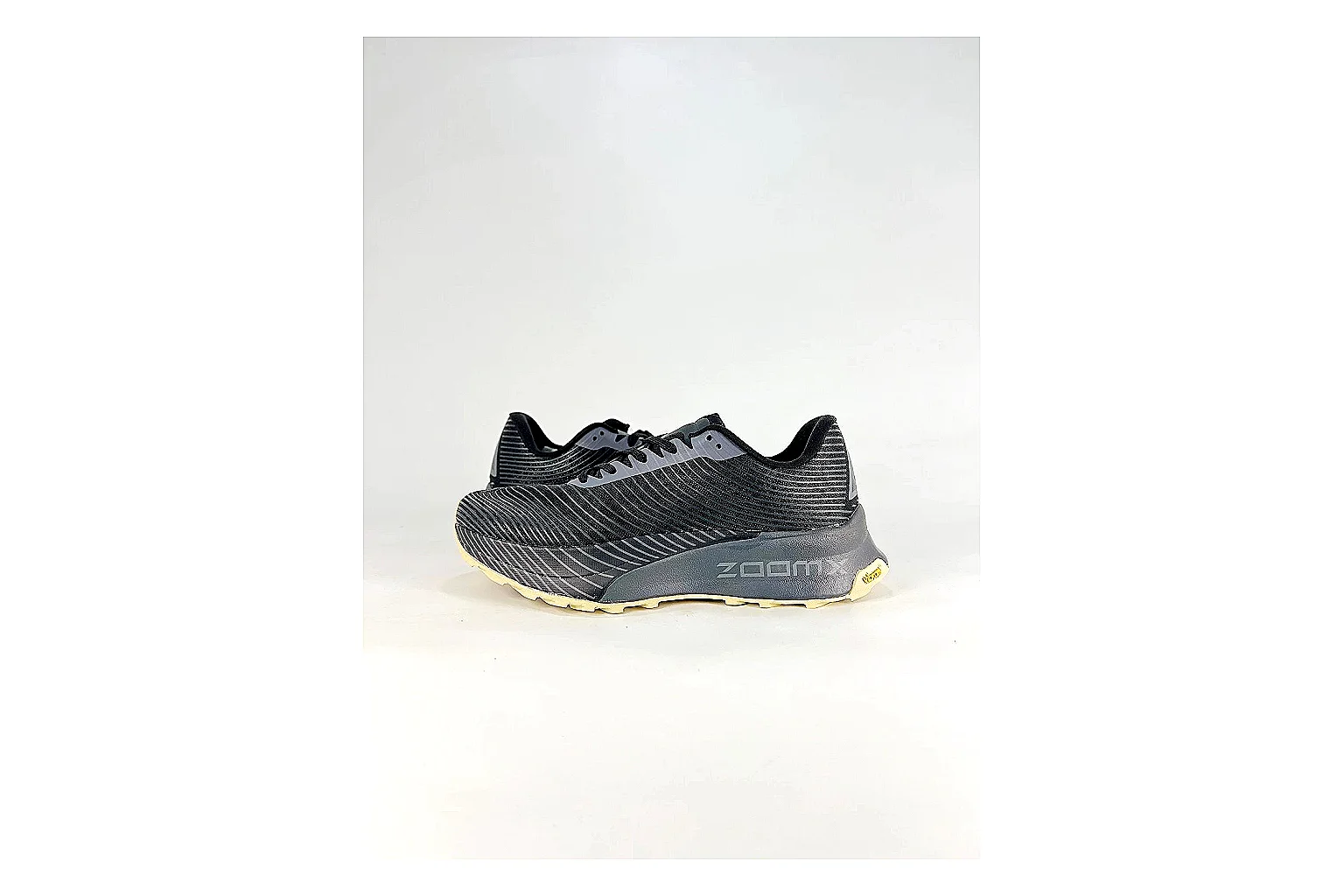 Nike ACG Ultra Black Gum Sneakers comparison signal photo with black gum outdoor sneakers with textile texture, side-profile shape, upper panel lines, and outsole detail