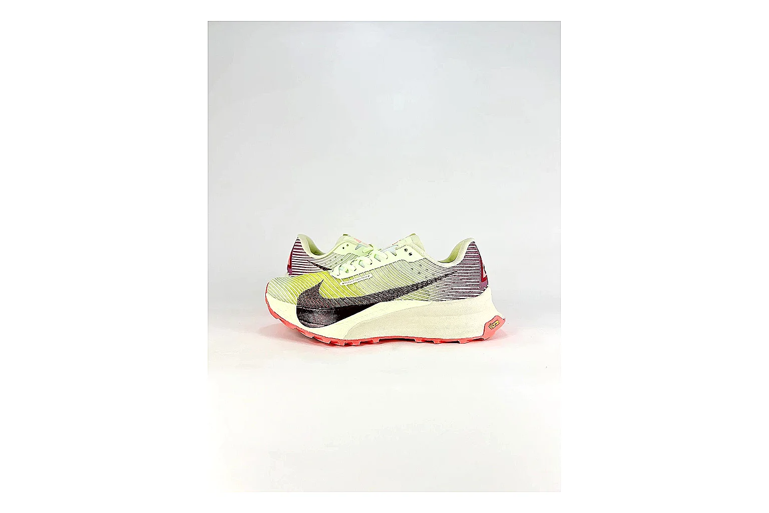 Nike ACG Ultra Lime Pink Sneakers comparison signal photo with lime pink outdoor sneakers with textile texture, side-profile shape, upper panel lines, and outsole detail