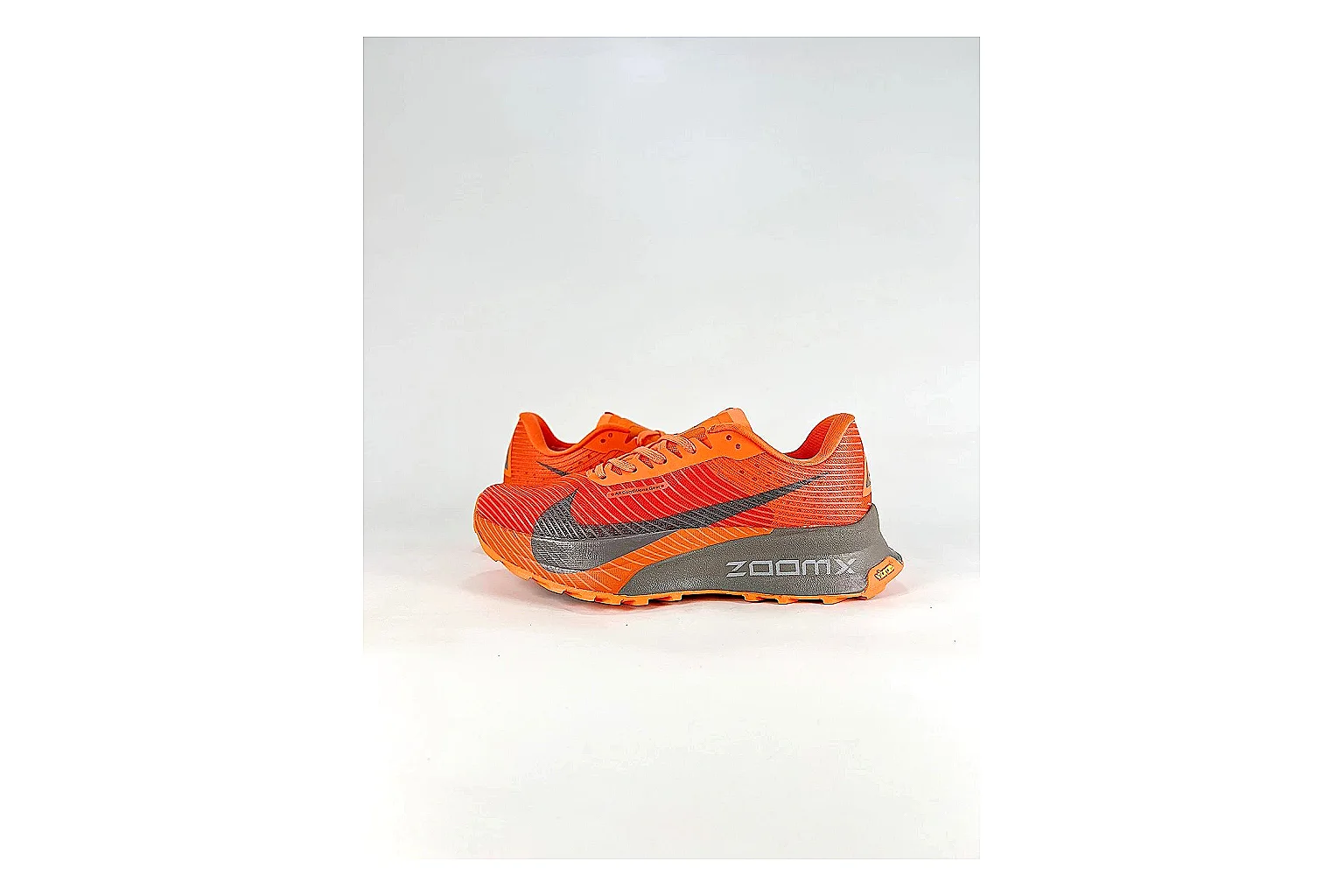 Nike ACG Ultra Orange Gray Sneakers comparison signal photo with orange gray outdoor sneakers with textile texture, side-profile shape, upper panel lines, and outsole detail