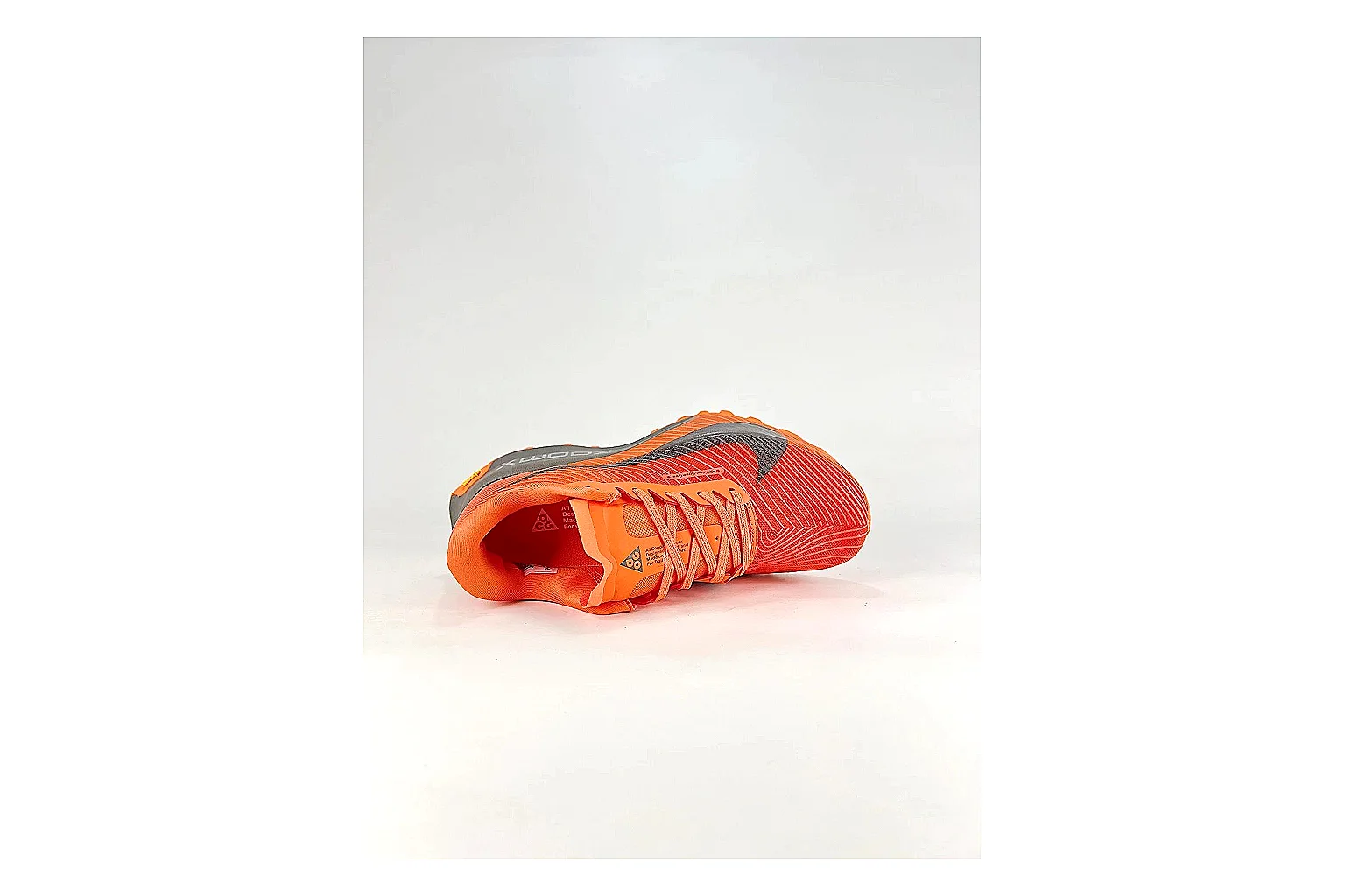 Nike ACG Ultra Orange Gray Sneakers comparison signal photo with orange gray outdoor sneakers with textile texture, side-profile shape, upper panel lines, and outsole detail