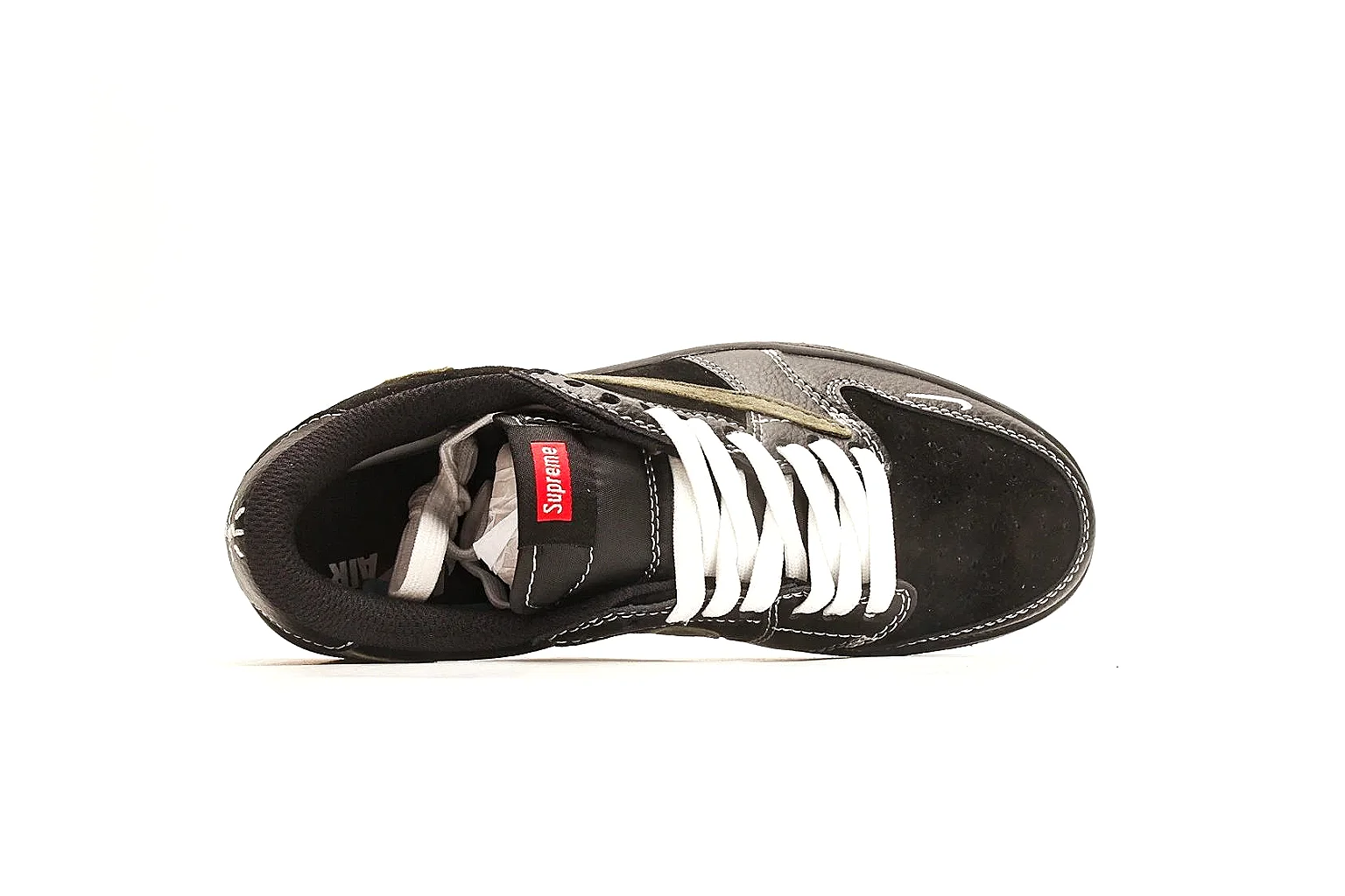 Nike Air Court Connect Black Olive Low Top comparison photo showing black low-top upper, olive Swoosh, white laces, side text graphics, and red accent details