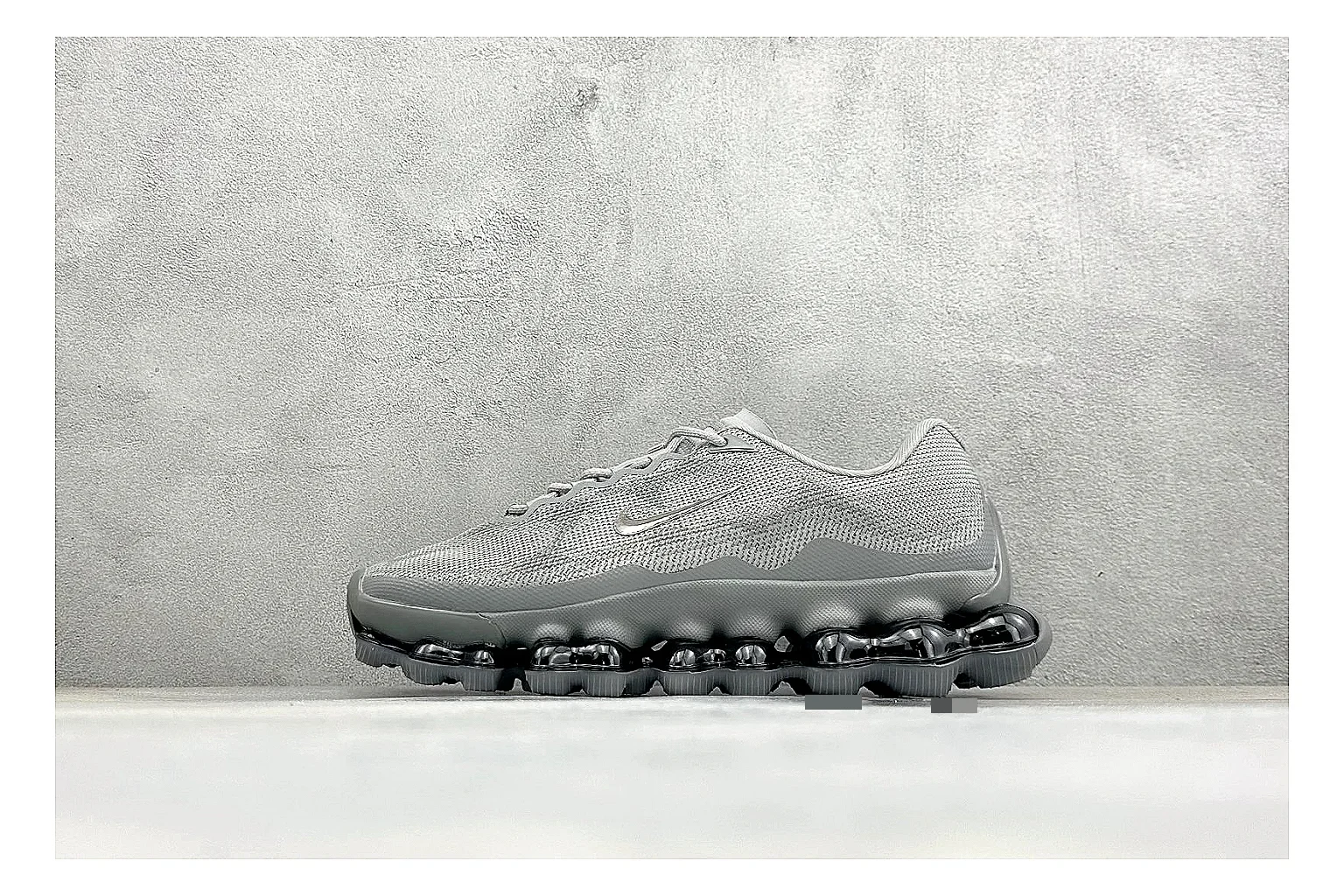 Nike Air Liquid Metal Silver comparison image with reflective silver upper, running-inspired panels, sculpted pod outsole, and glossy tech finish
