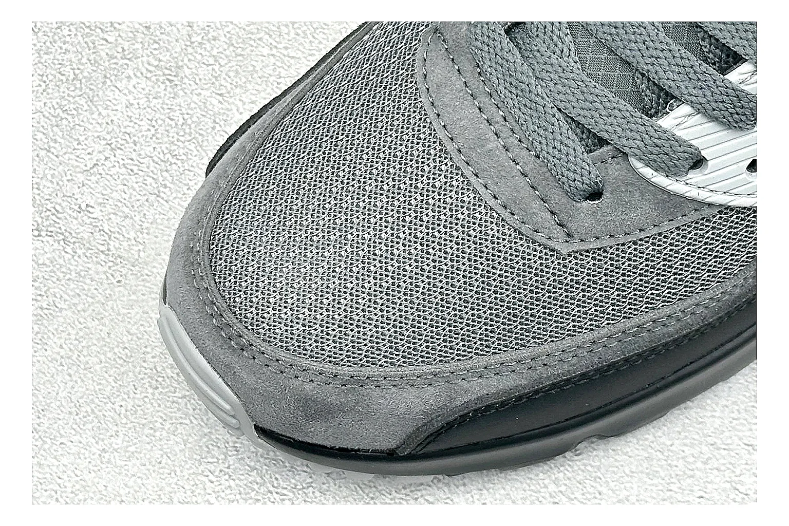 Nike Air Max 90 Grey Black comparison photo showing grey and black layered upper, visible Air window, classic Air Max 90 panels, and sturdy retro sole thumbnail 5