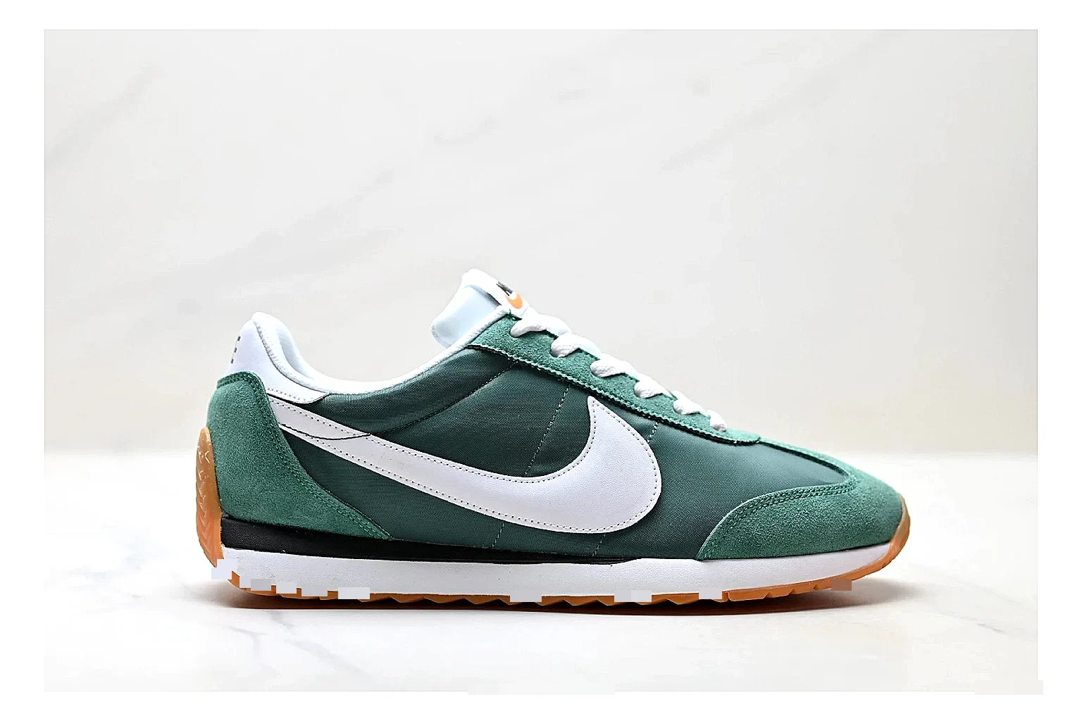 Nike Cortez Green White comparison photo showing green white leather low-top upper, slim retro runner profile, Swoosh detail, and classic Cortez sole