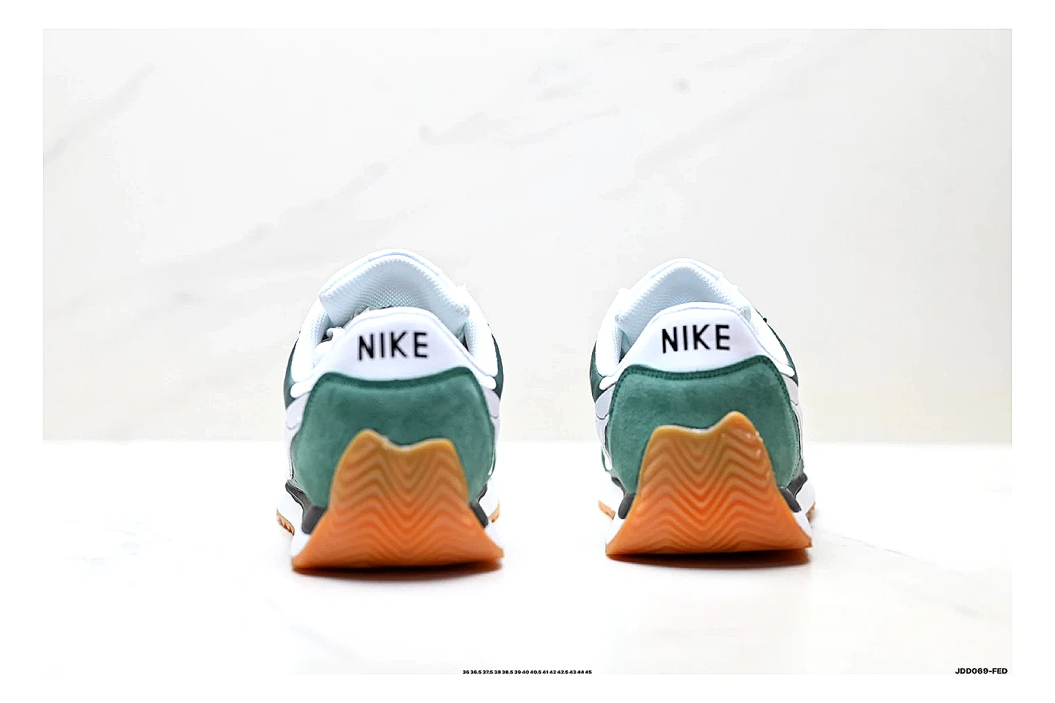 Nike Cortez Green White comparison photo showing green white leather low-top upper, slim retro runner profile, Swoosh detail, and classic Cortez sole thumbnail 3