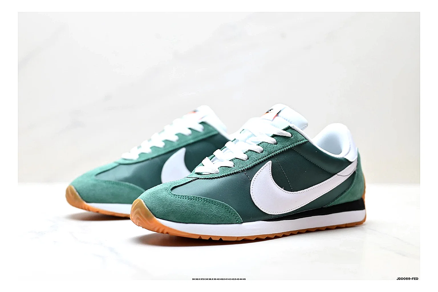 Nike Cortez Green White comparison photo showing green white leather low-top upper, slim retro runner profile, Swoosh detail, and classic Cortez sole thumbnail 4
