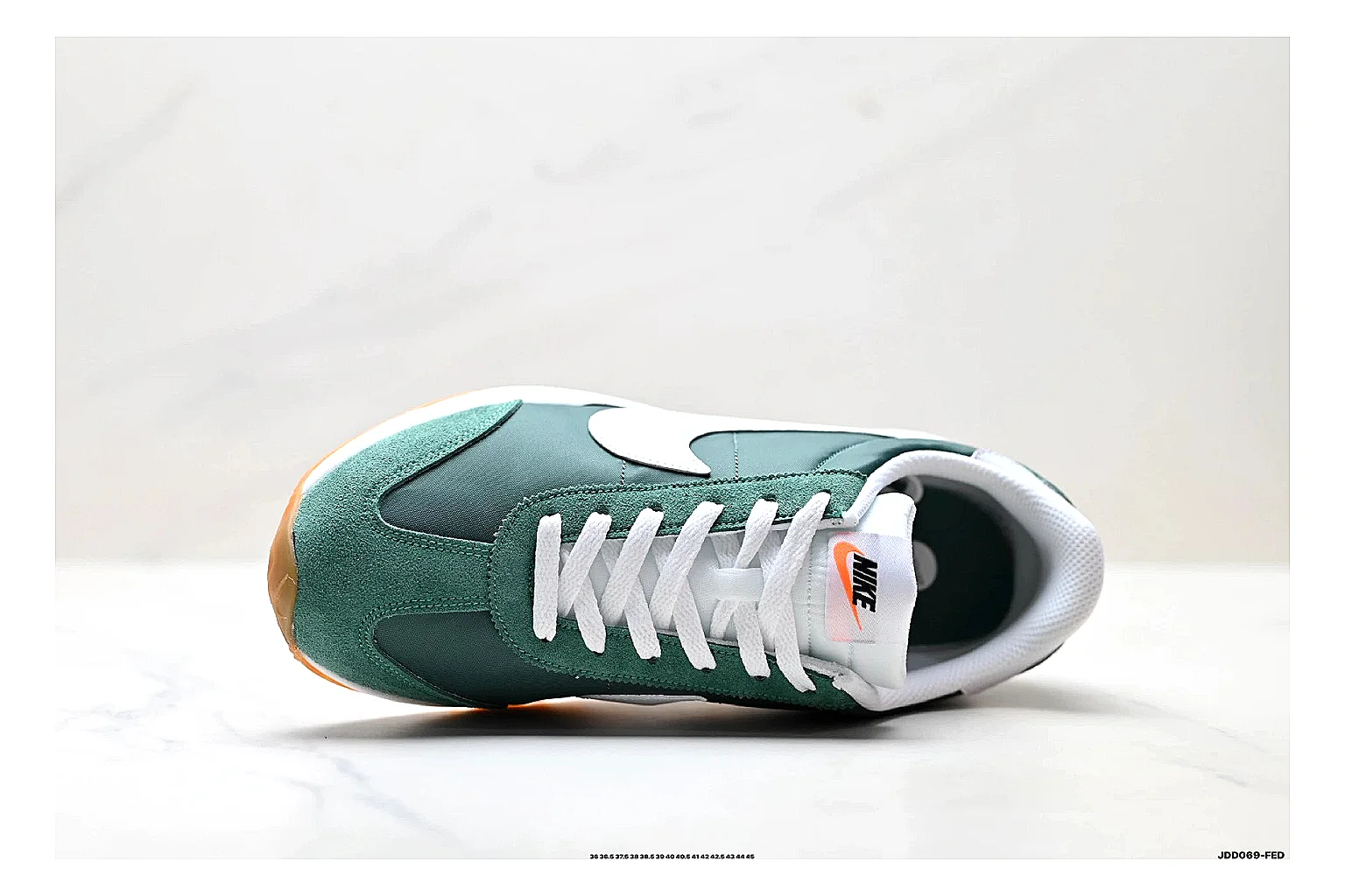 Nike Cortez Green White comparison photo showing green white leather low-top upper, slim retro runner profile, Swoosh detail, and classic Cortez sole thumbnail 6