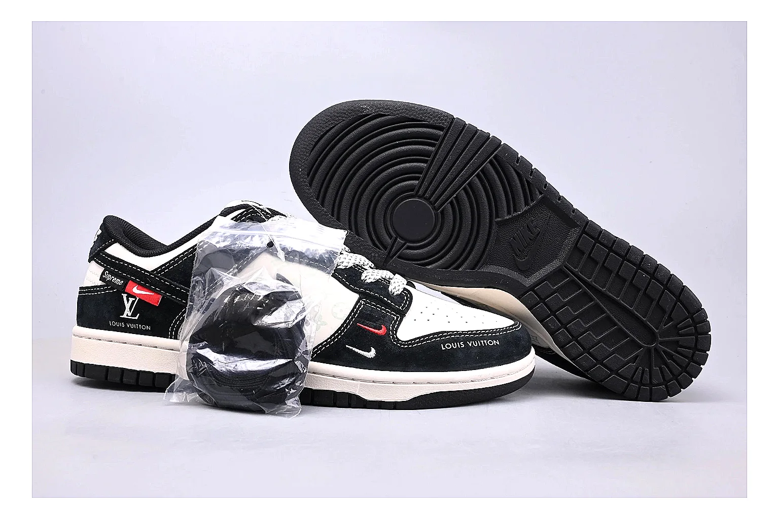 Nike Dunk Low Black White comparison photo showing black and white leather panels, low Dunk silhouette, padded collar, and basketball-retro sole thumbnail 3