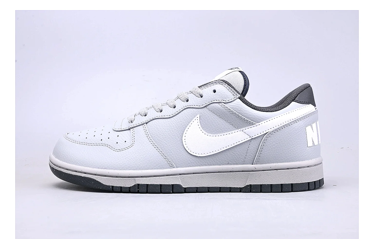 Nike Dunk Low White Gray comparison photo showing white and gray leather panels, low Dunk shape, padded collar, and basketball-retro sole