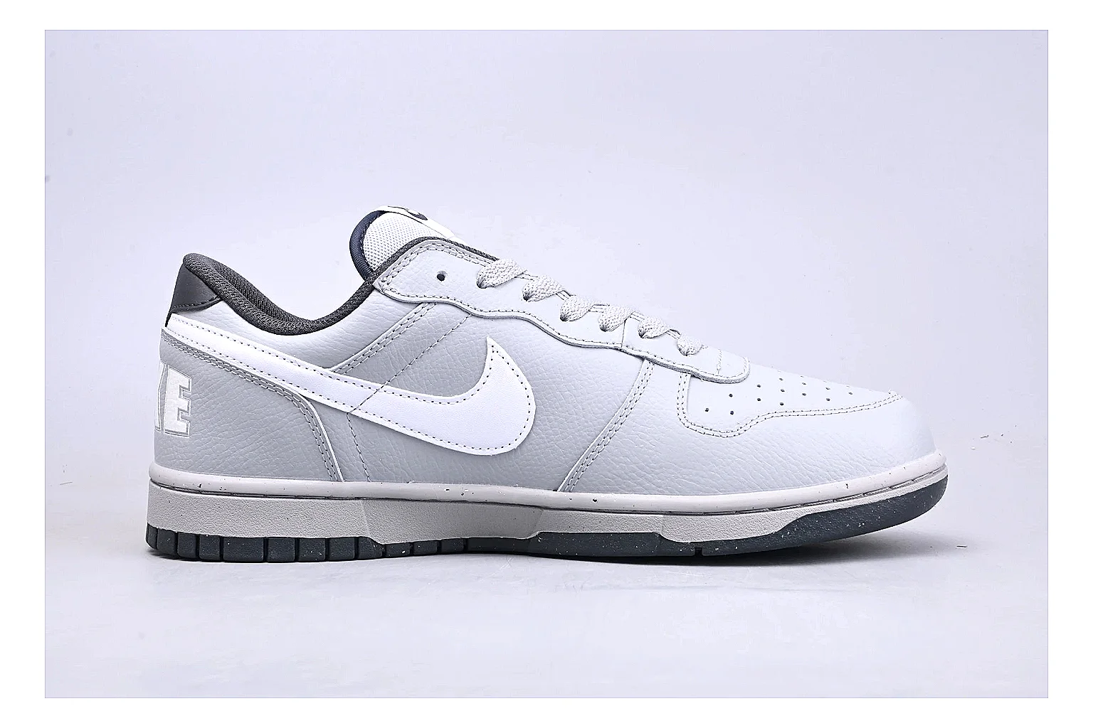 Nike Dunk Low White Gray comparison photo showing white and gray leather panels, low Dunk shape, padded collar, and basketball-retro sole thumbnail 6