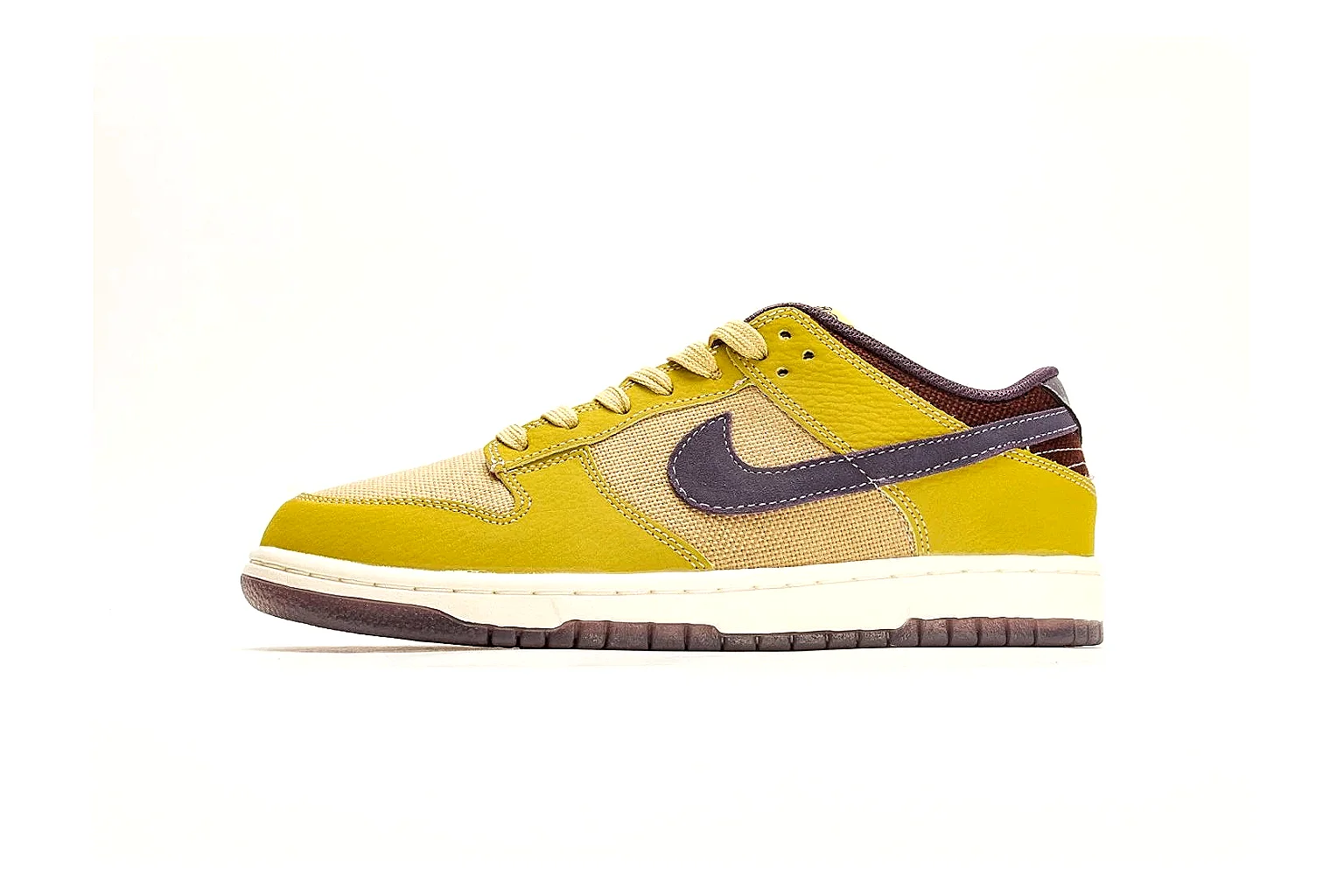 Nike Dunk Low Yellow Purple comparison photo showing yellow and purple leather panels, dark Swoosh, heel overlay, cream midsole, and brown outsole