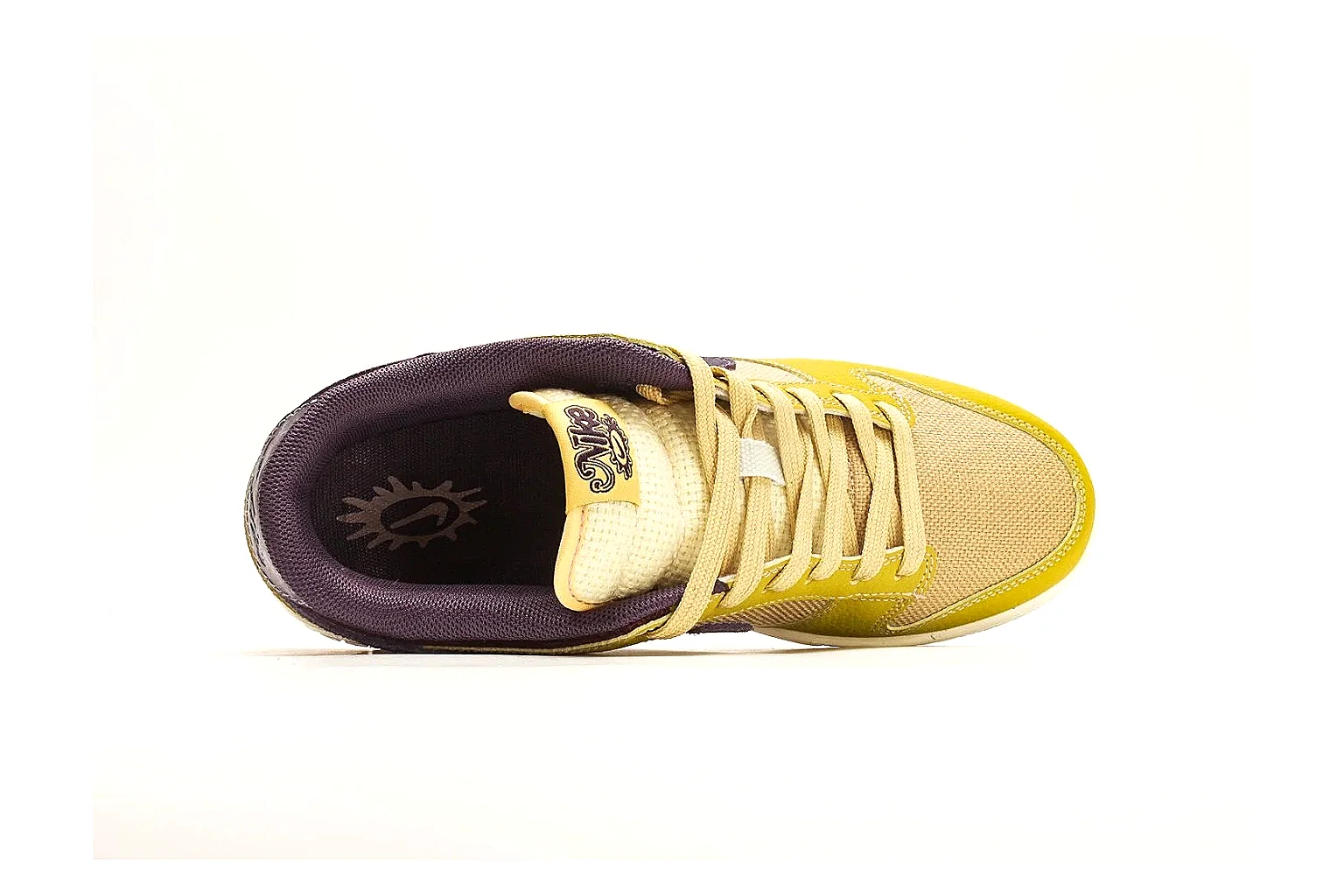Nike Dunk Low Yellow Purple comparison photo showing yellow and purple leather panels, dark Swoosh, heel overlay, cream midsole, and brown outsole