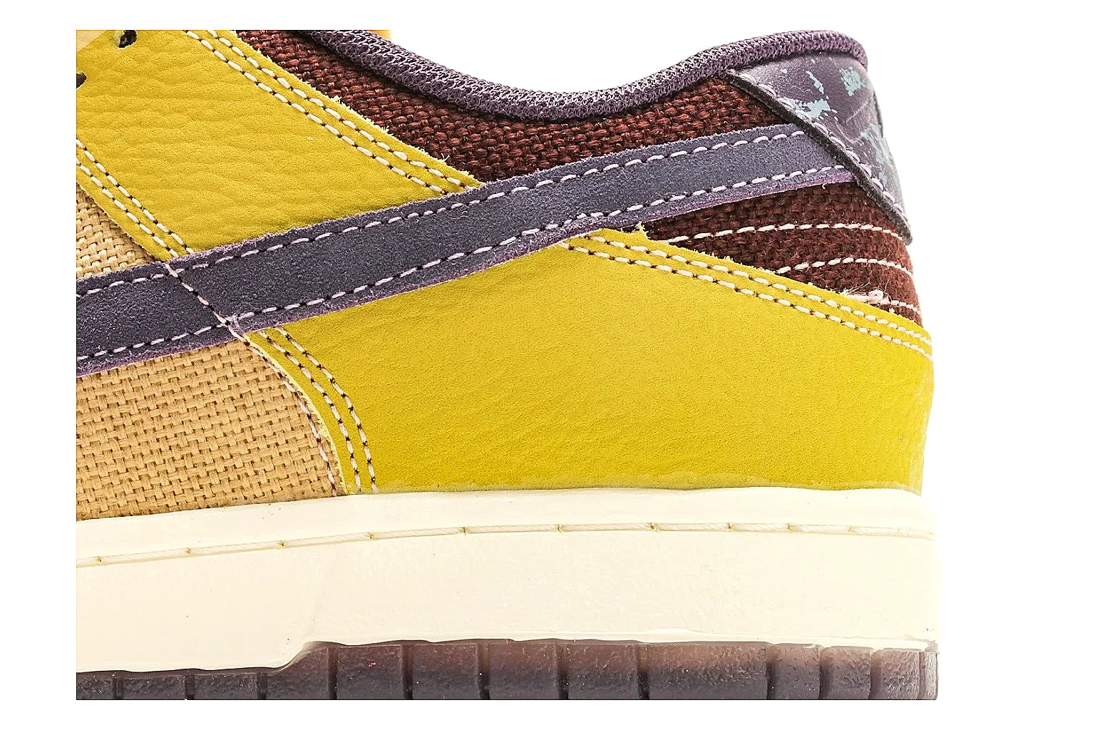 Nike Dunk Low Yellow Purple comparison photo showing yellow and purple leather panels, dark Swoosh, heel overlay, cream midsole, and brown outsole thumbnail 5