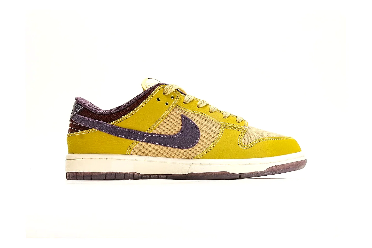Nike Dunk Low Yellow Purple comparison photo showing yellow and purple leather panels, dark Swoosh, heel overlay, cream midsole, and brown outsole thumbnail 6