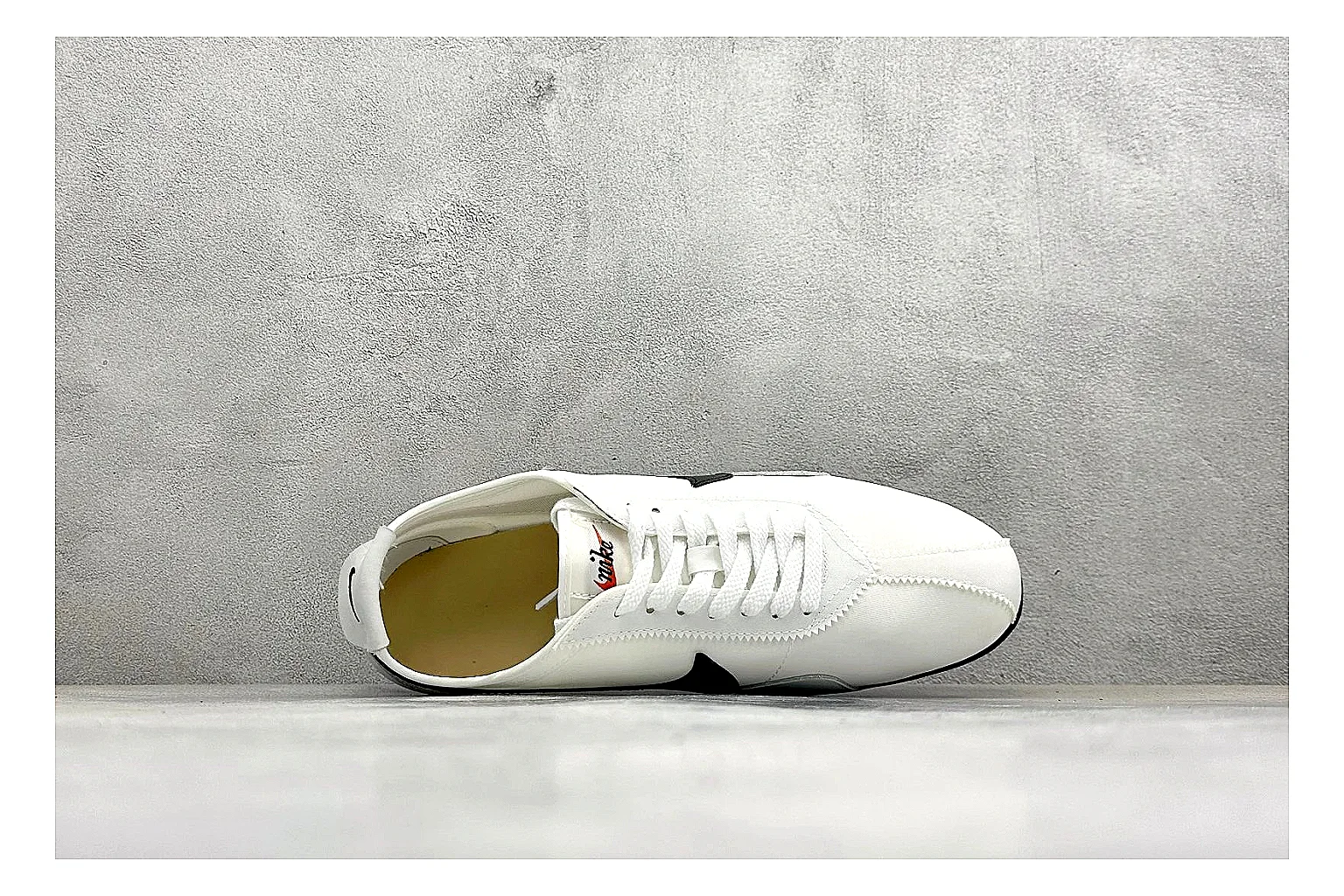 Nike Moon Shoe OG White Black comparison image with white upper, black Swoosh, slim retro runner shape, and waffle-style outsole
