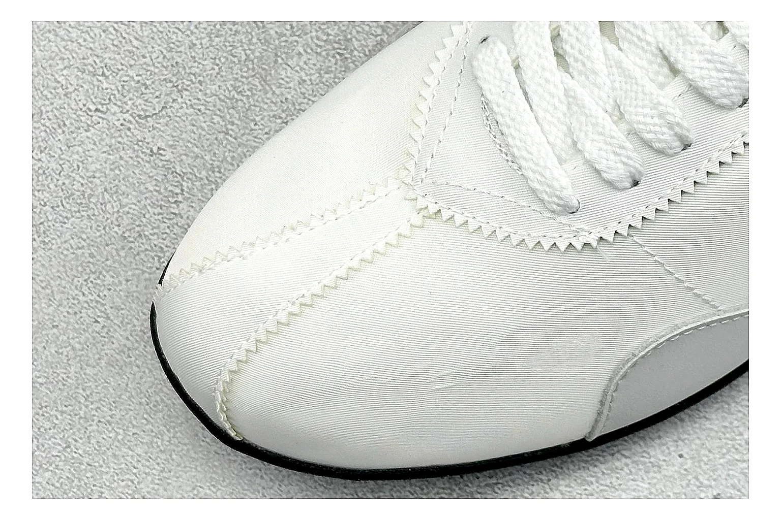 Nike Moon Shoe OG White Black comparison image with white upper, black Swoosh, slim retro runner shape, and waffle-style outsole thumbnail 5