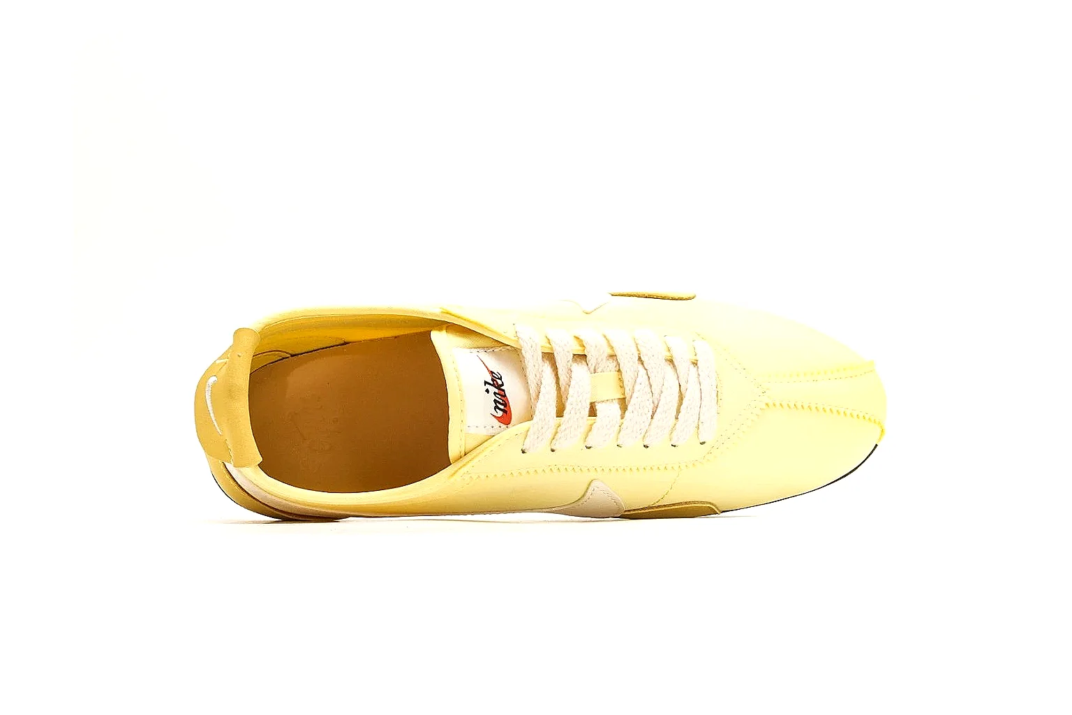 Nike Moon Yellow Retro Runner comparison photo showing yellow slim runner upper, white Swoosh, low retro profile, white midsole, and black waffle outsole thumbnail 2